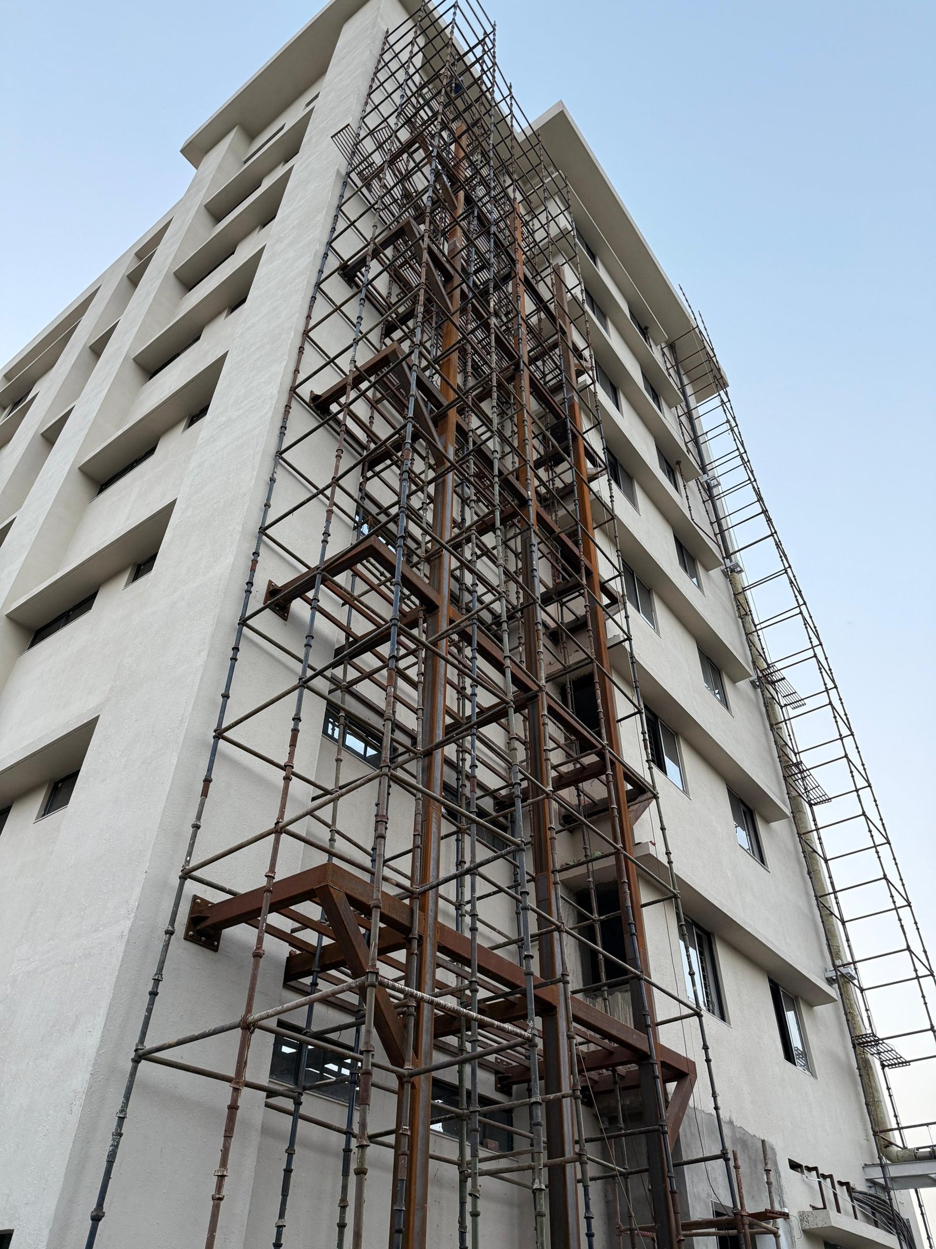 people walking on sidewalk near building during daytime