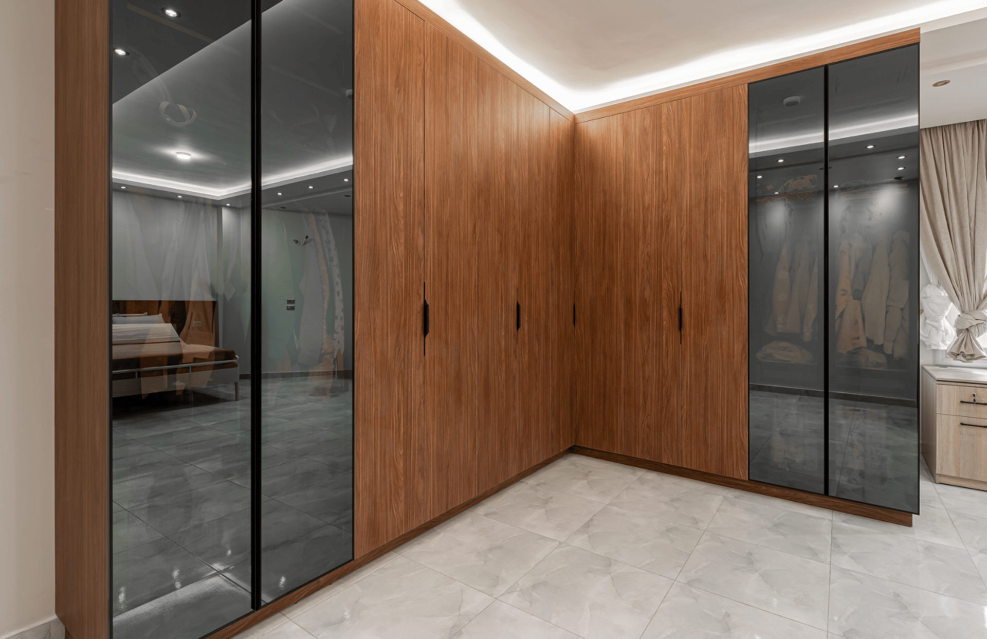 an abstract photo of a curved building with a blue sky in the background