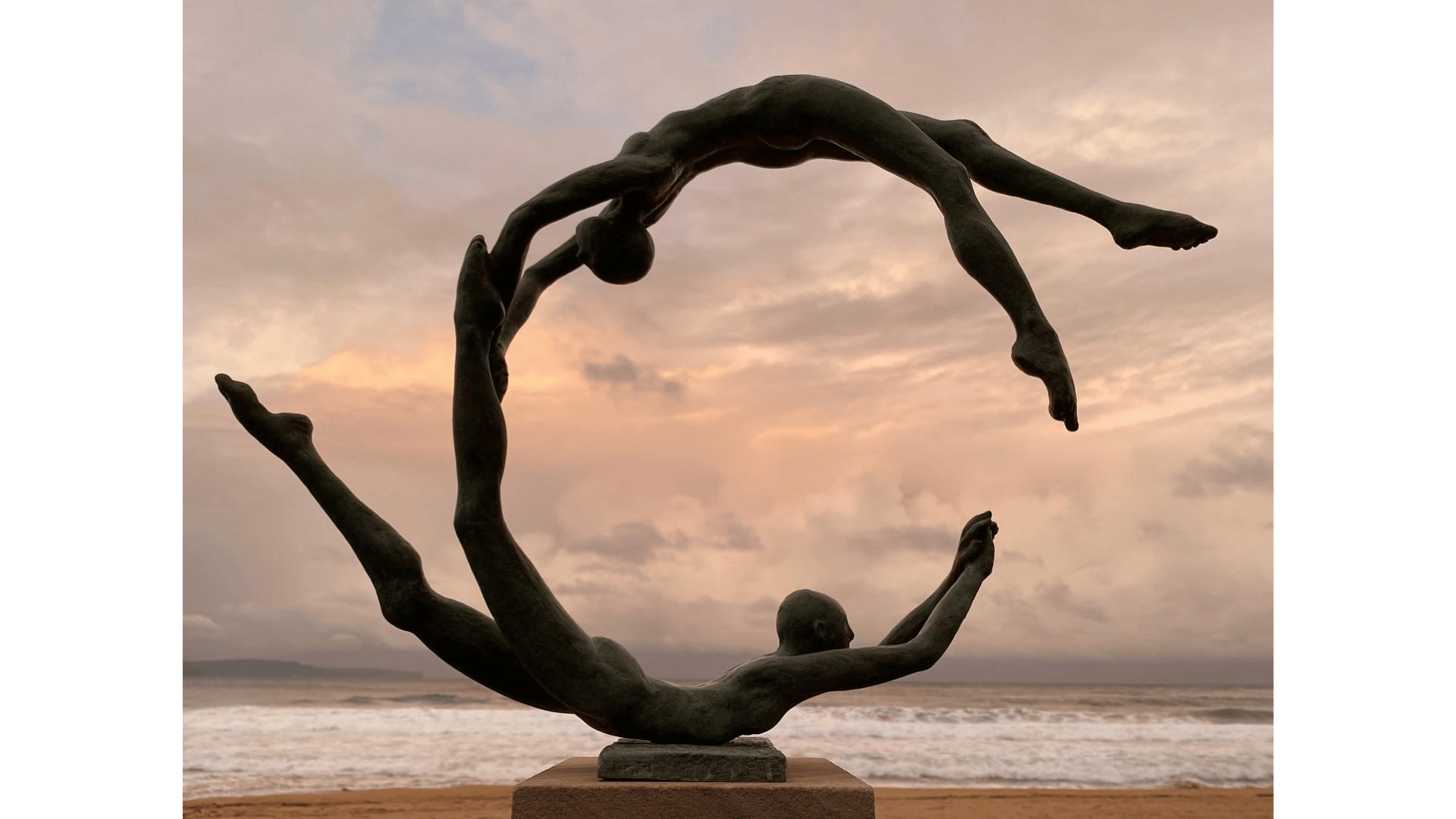 an abstract photo of a curved building with a blue sky in the background