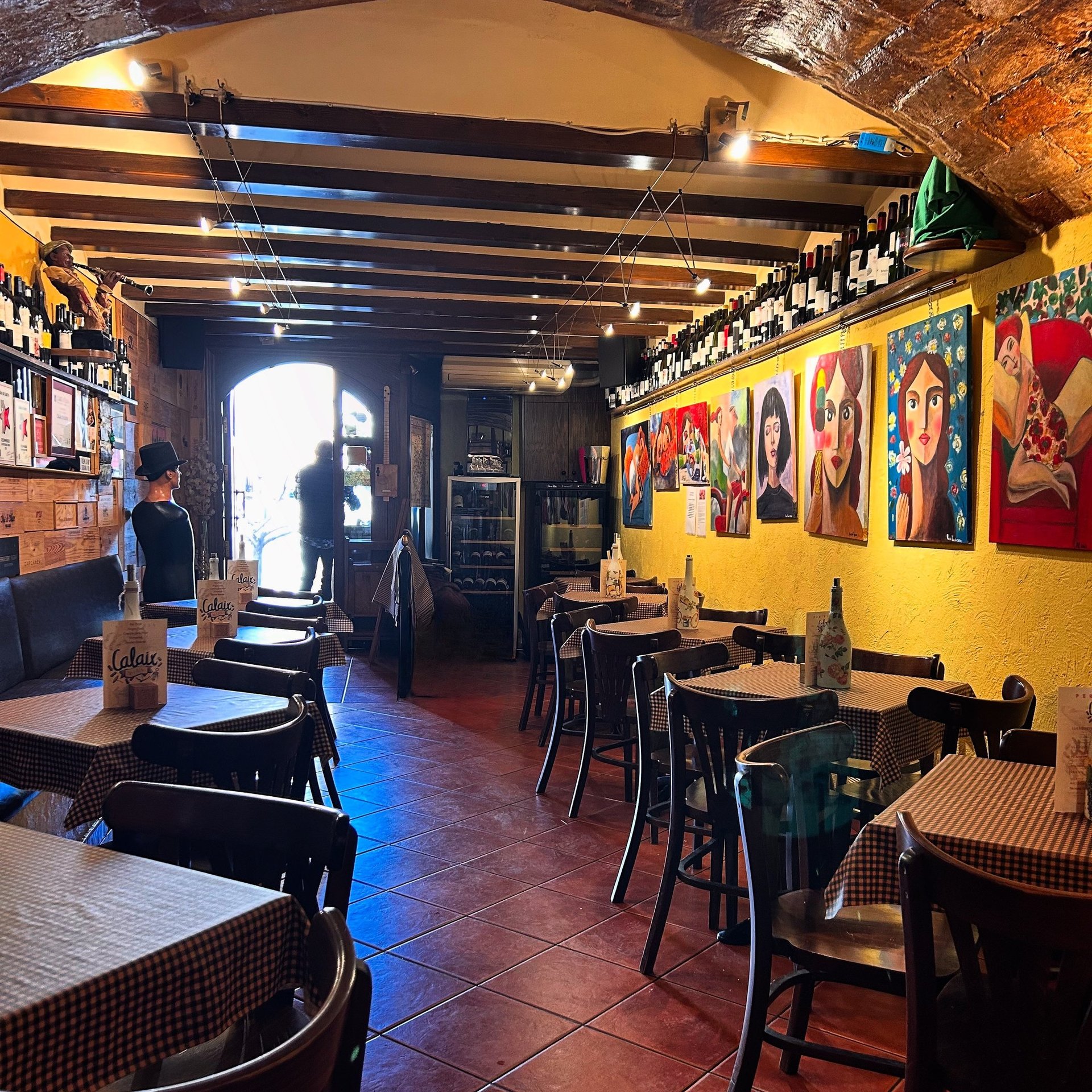 woman wearing yellow long-sleeved dress under white clouds and blue sky during daytime