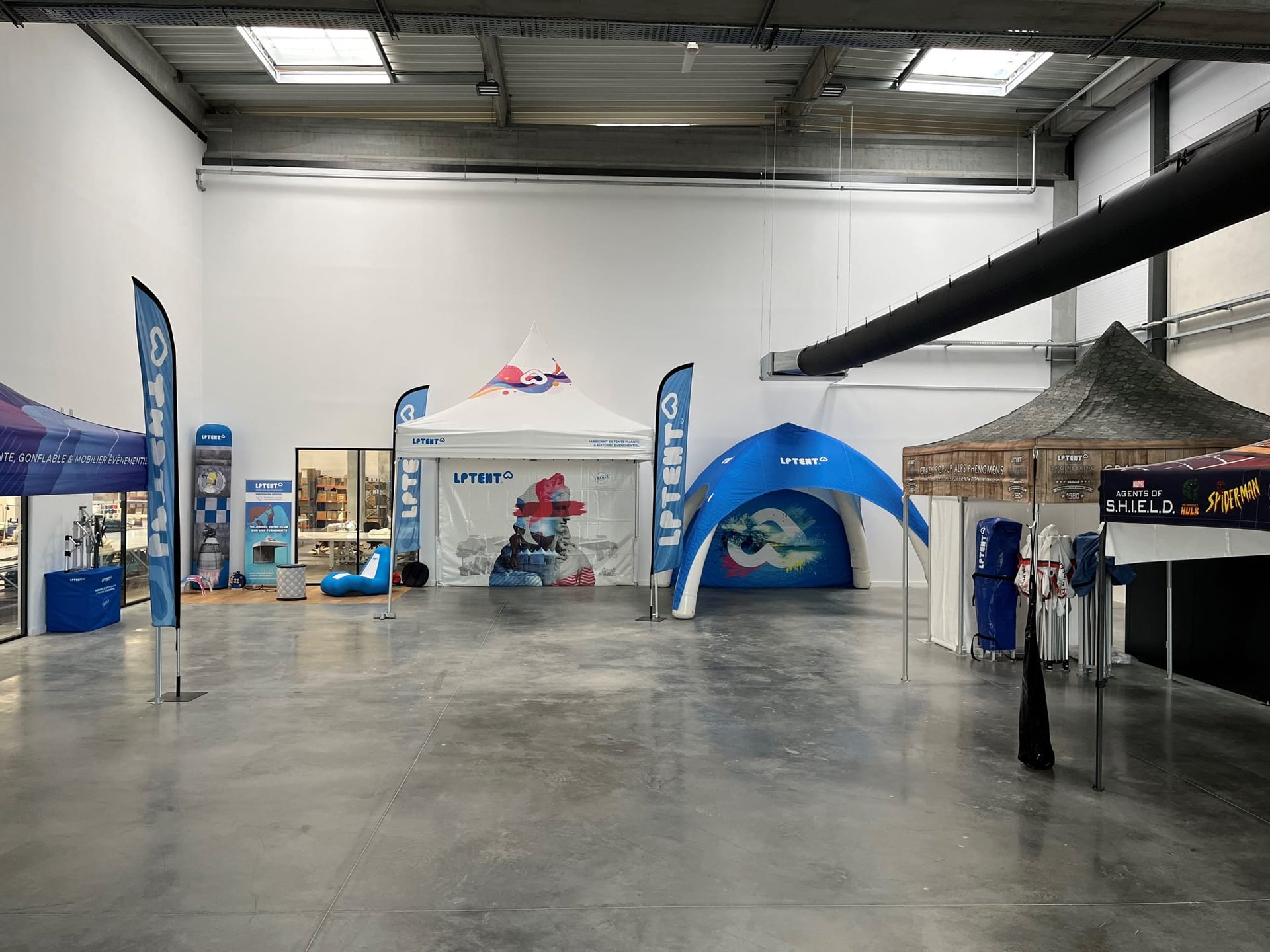 an abstract photo of a curved building with a blue sky in the background