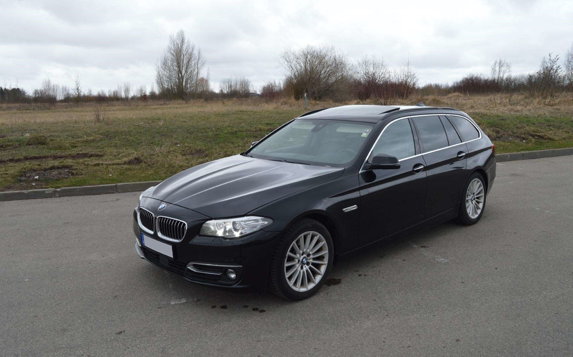 an abstract photo of a curved building with a blue sky in the background