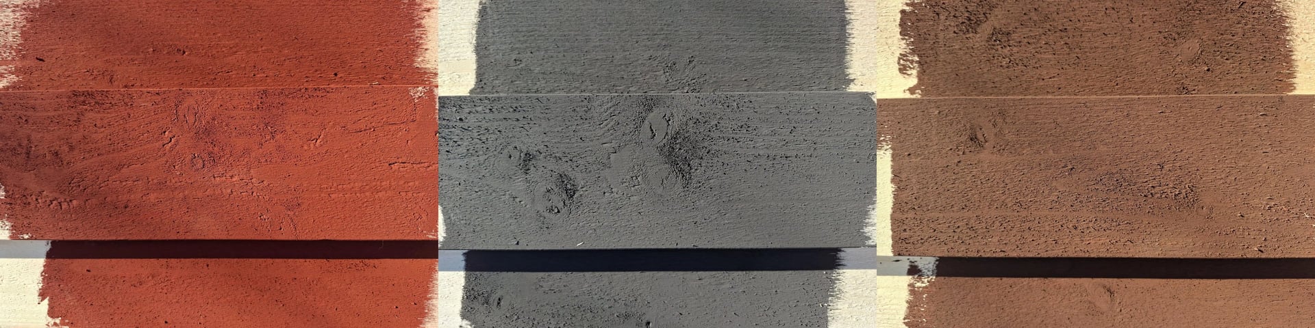 three sampoles of barn paint on rough wood : red, black, brown