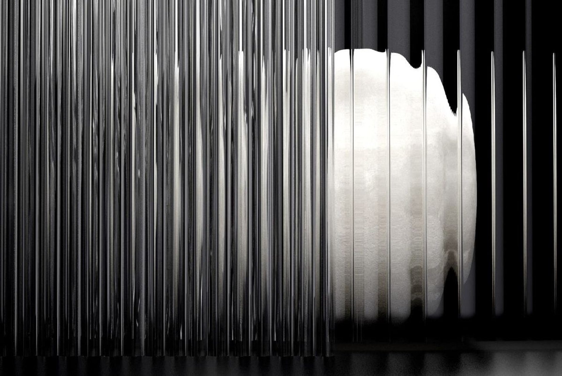 an abstract photo of a curved building with a blue sky in the background