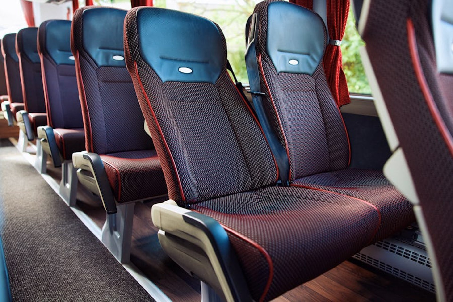 Close-up of a bus with building reflection.