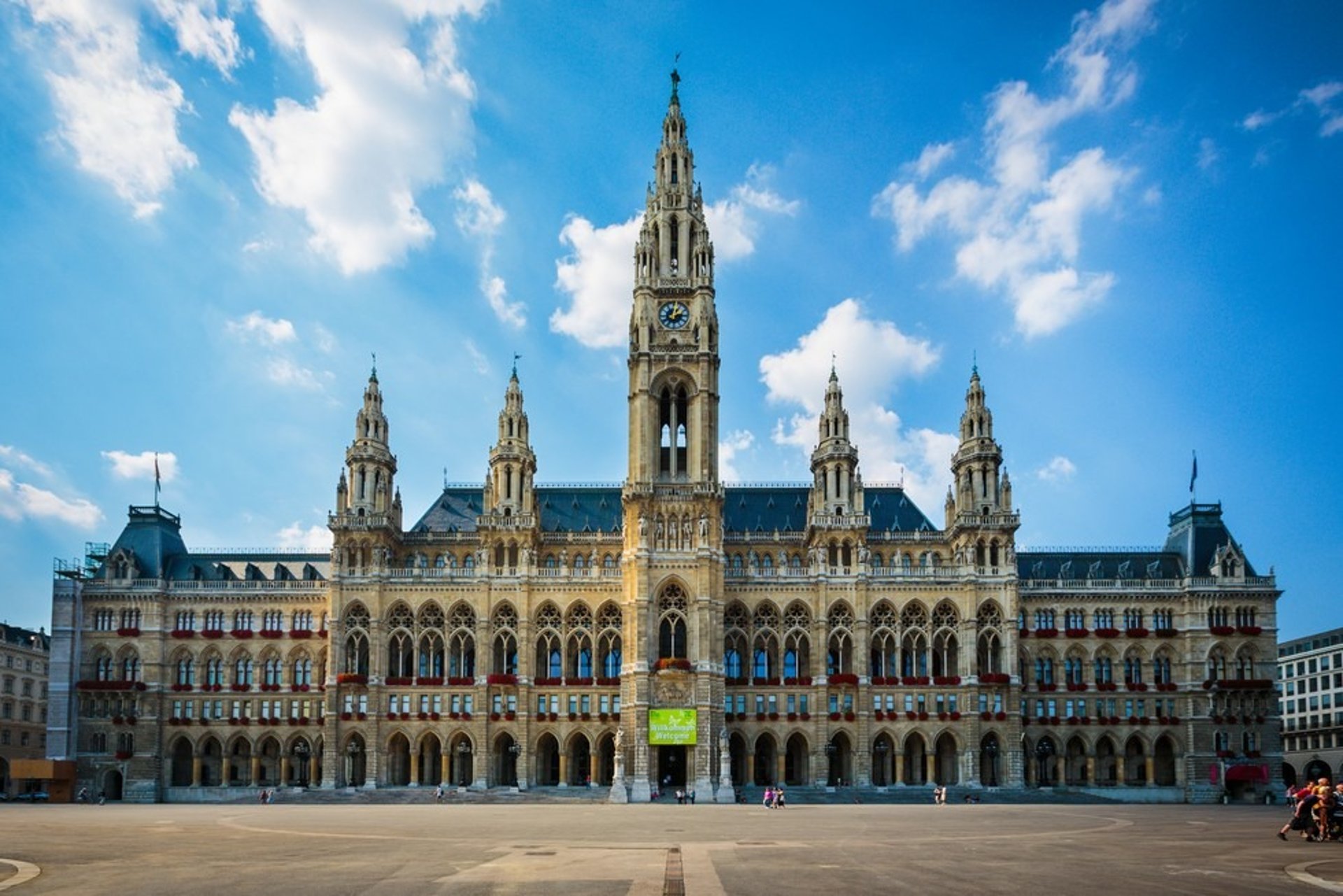 a large building with a christmas tree in front of it