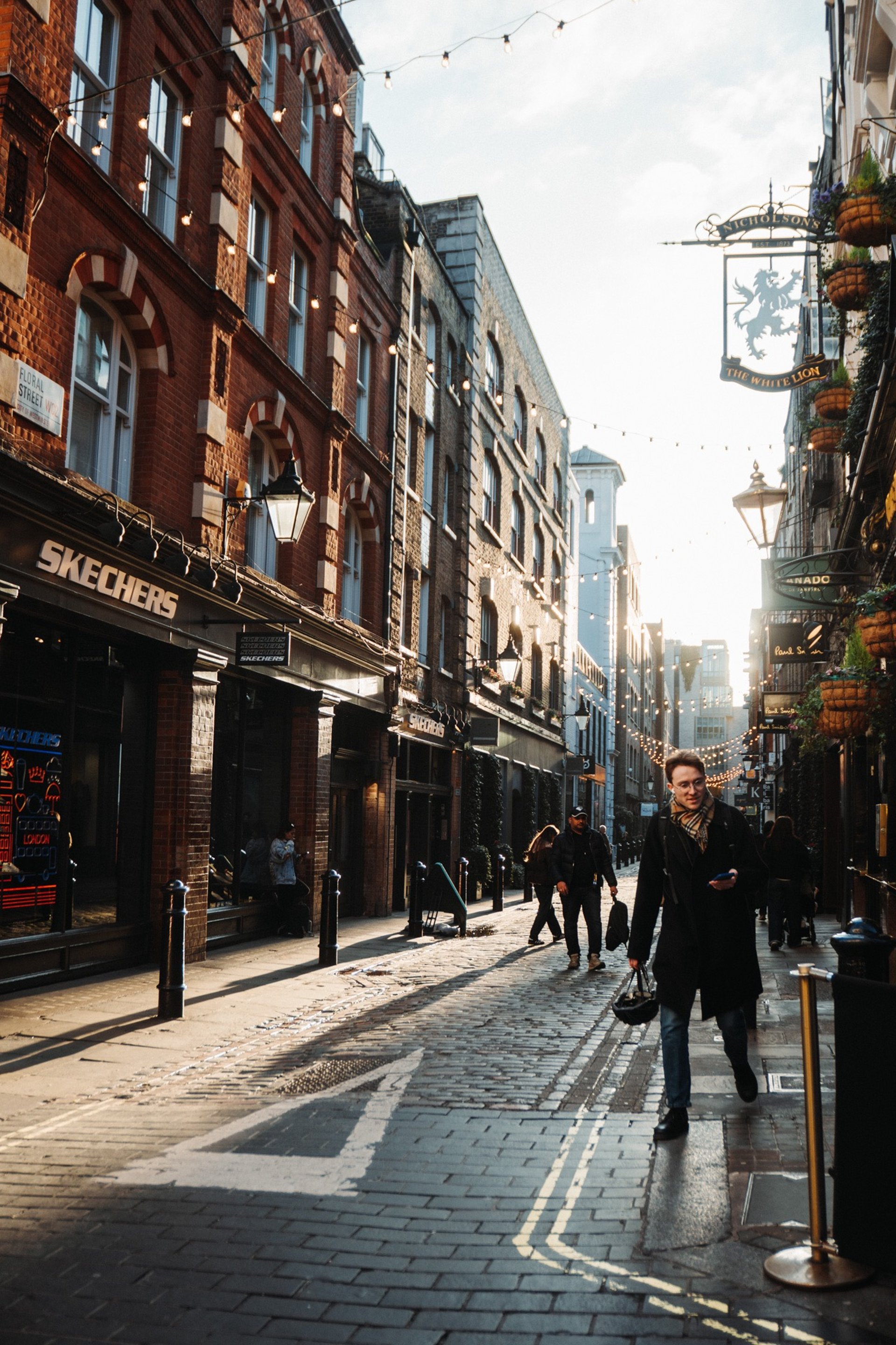 a group of people standing inside of a building