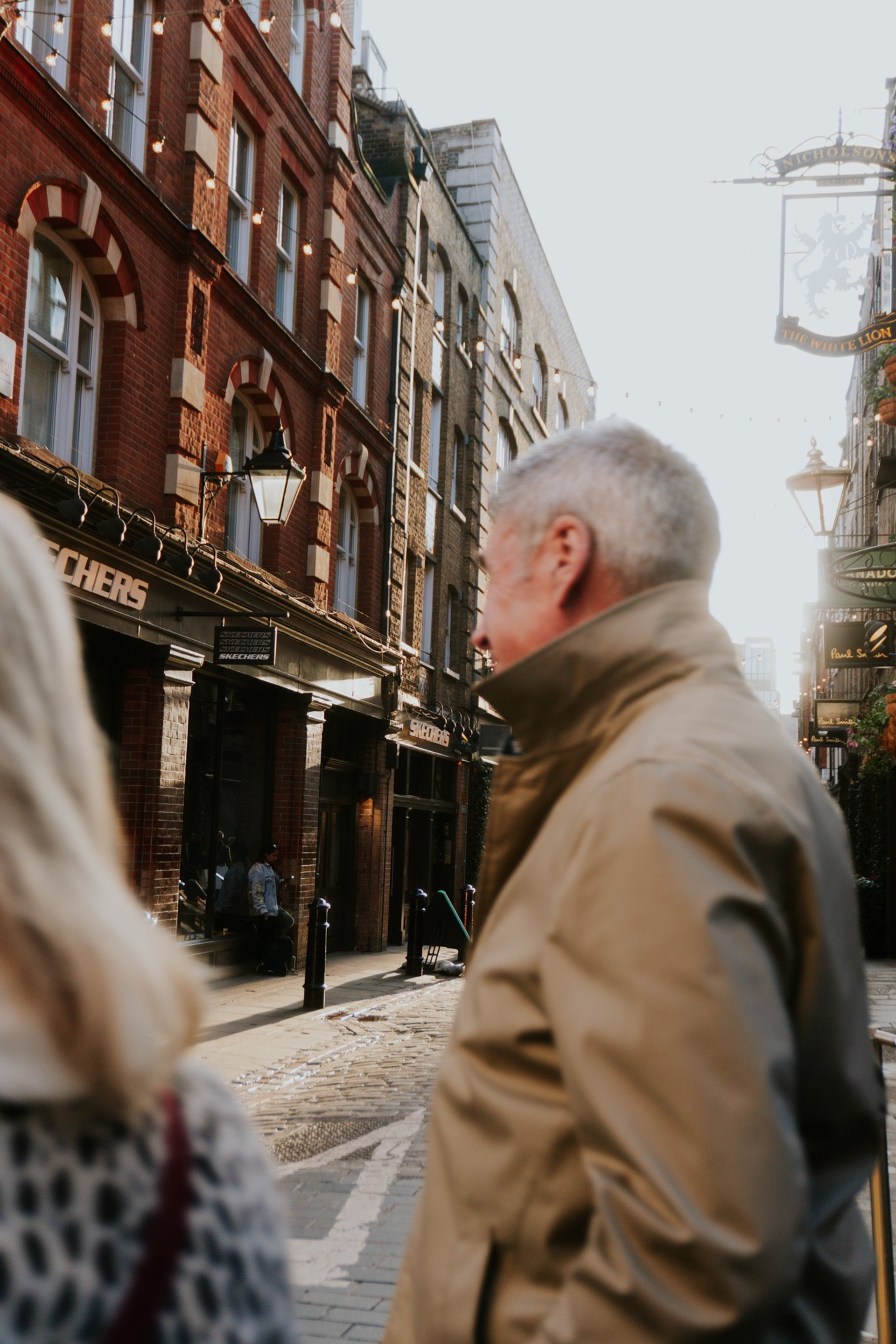 an abstract photo of a curved building with a blue sky in the background