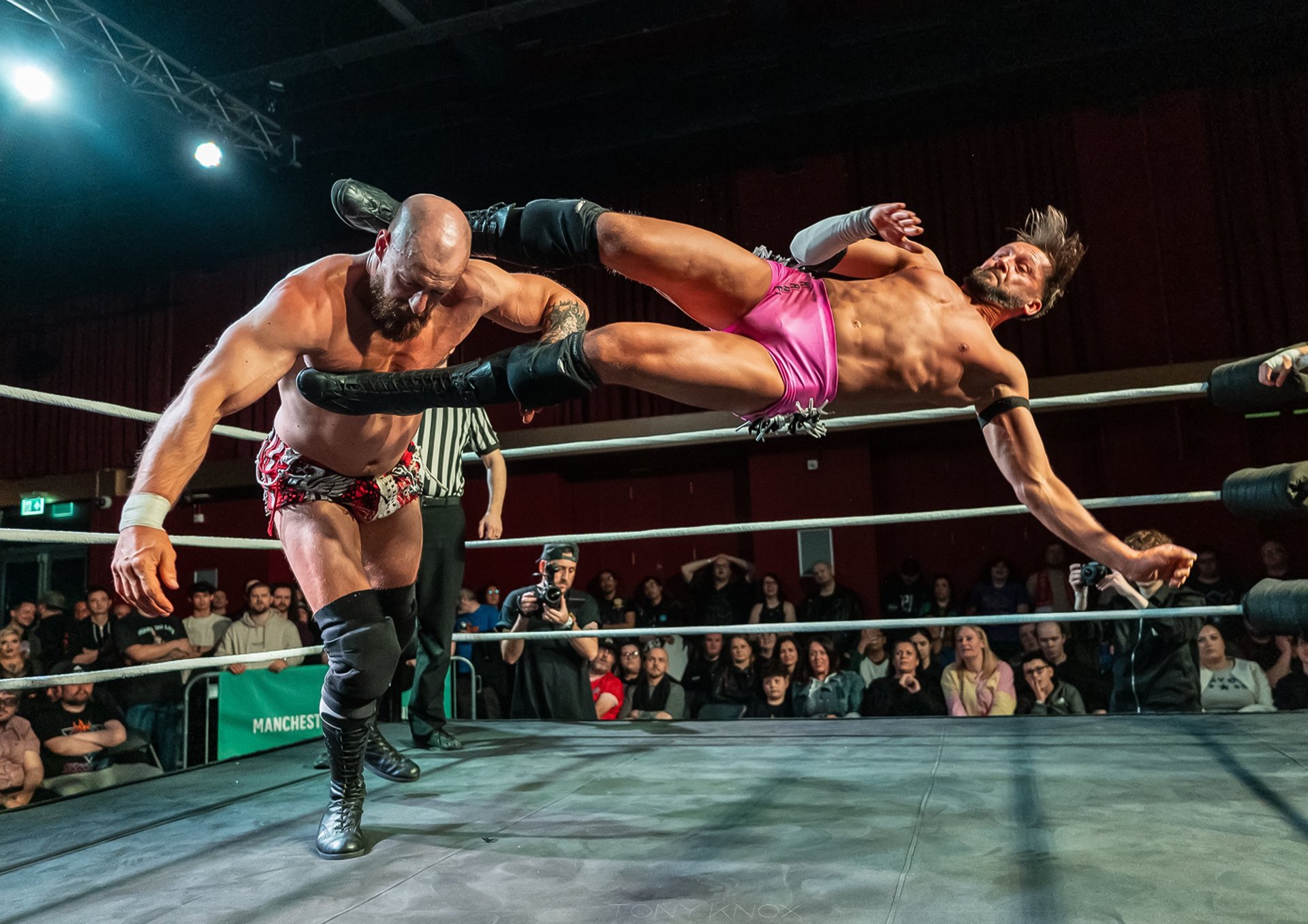 an abstract photo of a curved building with a blue sky in the background