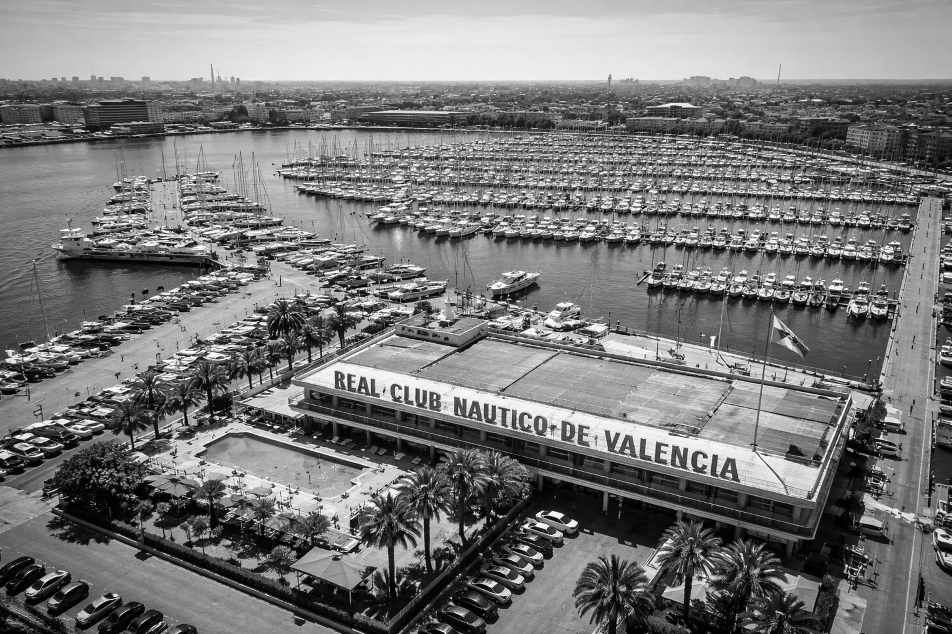 an abstract photo of a curved building with a blue sky in the background