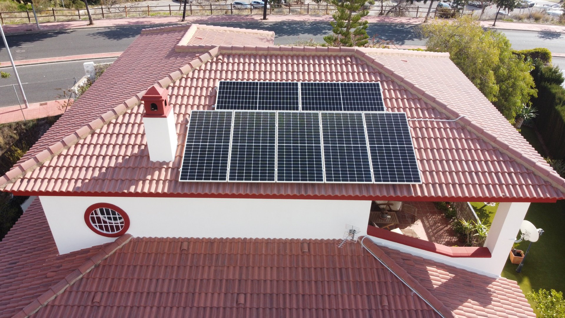 a man talking on a phone while holding a phone to his ear