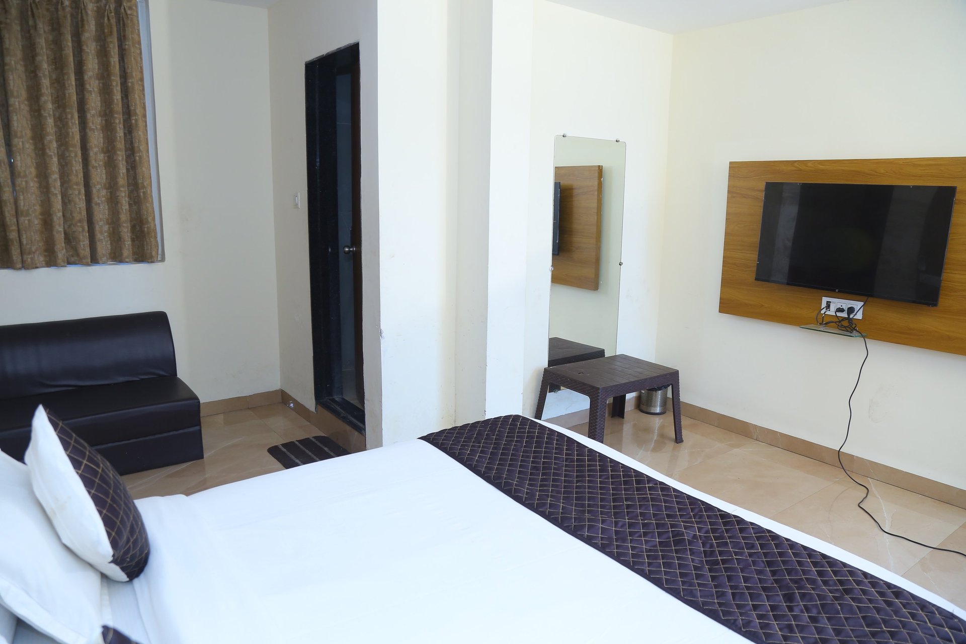 sunloungers fronting buildings near mountain