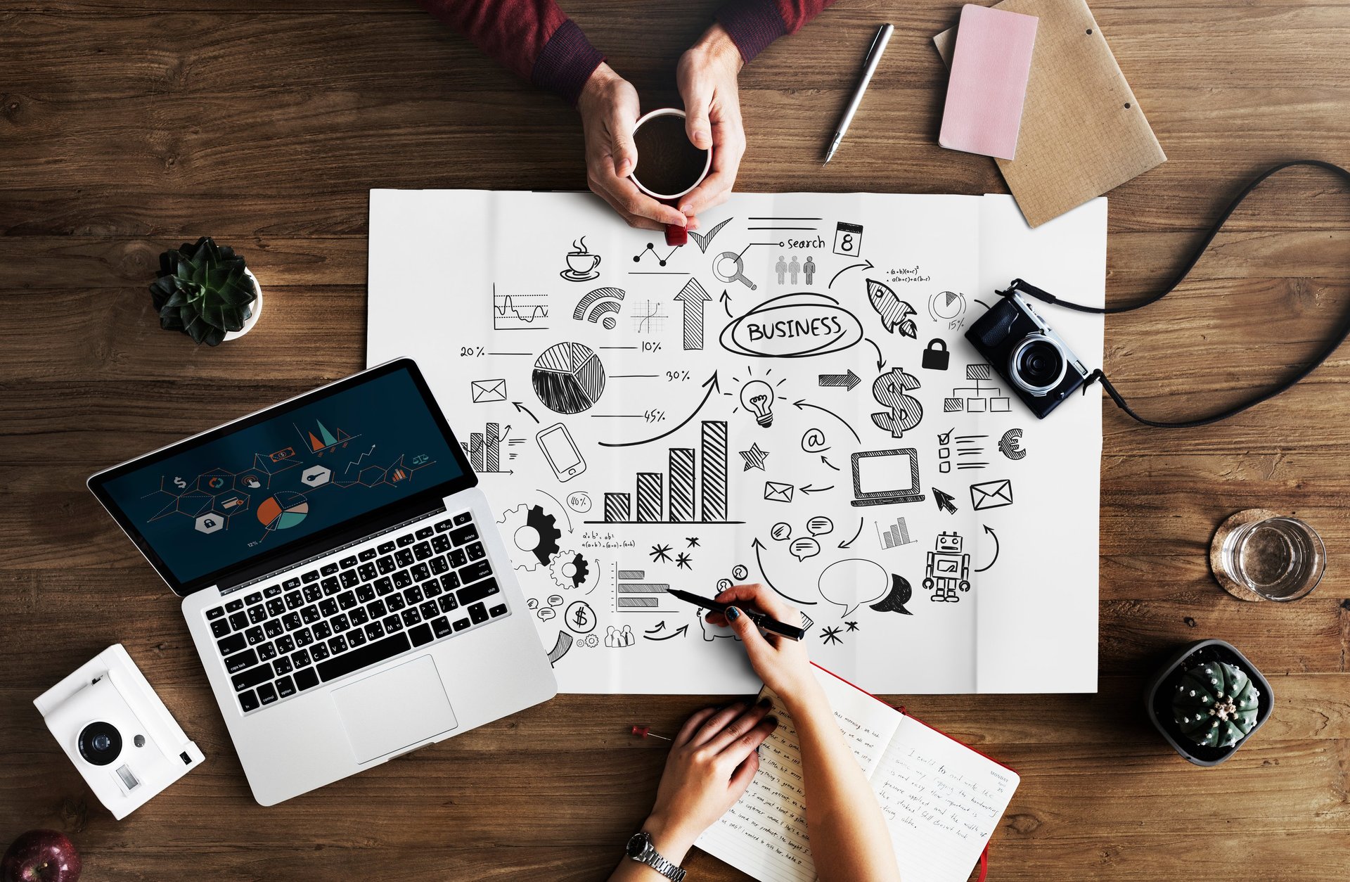 Two people working on business planning together