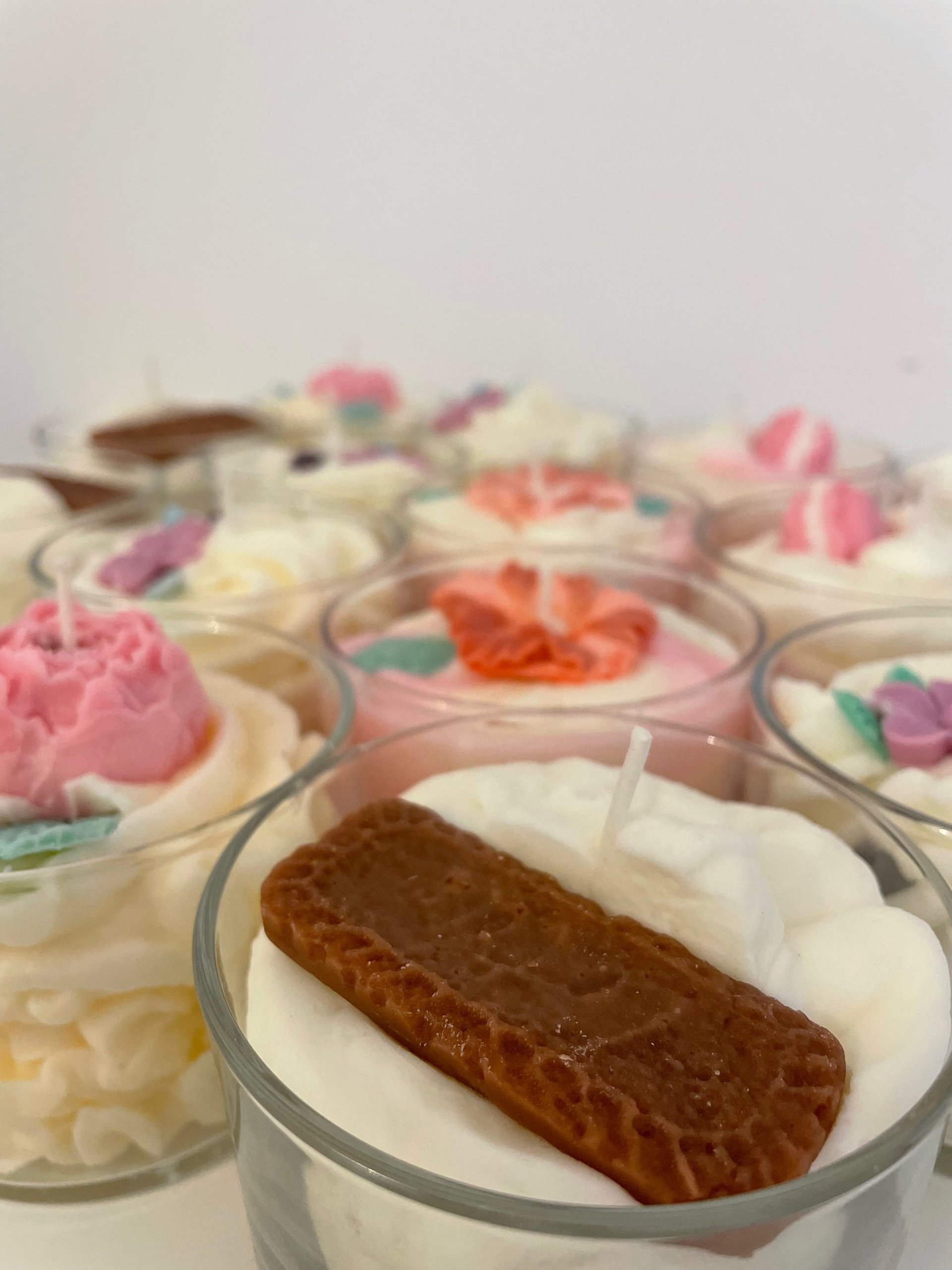 white candle on clear glass holder