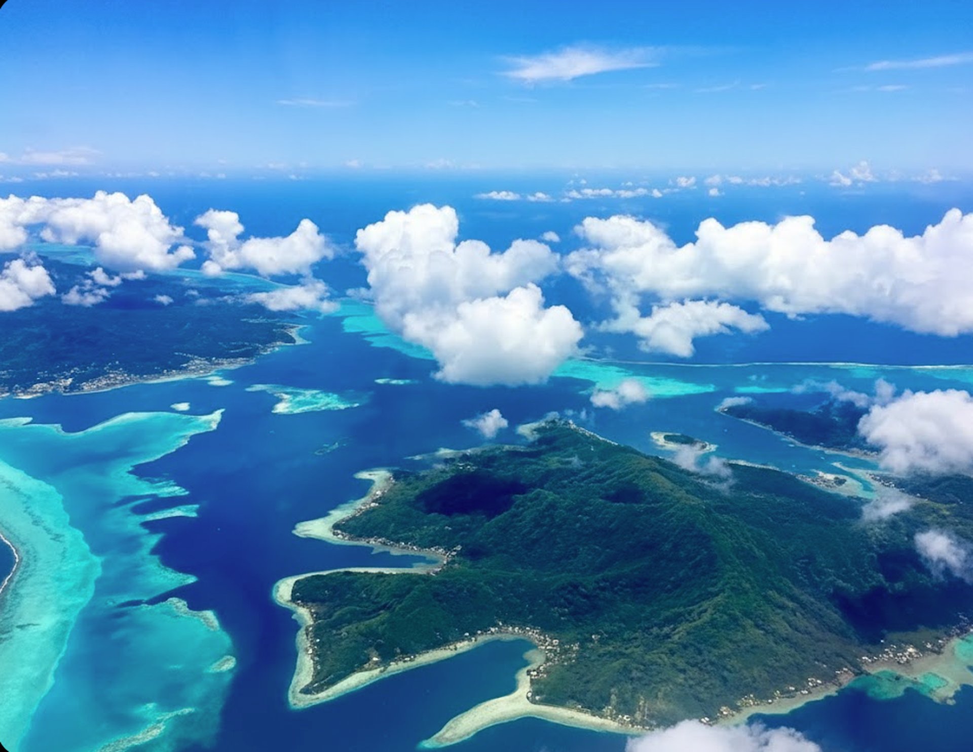 an aerial view of an island in the middle of the ocean