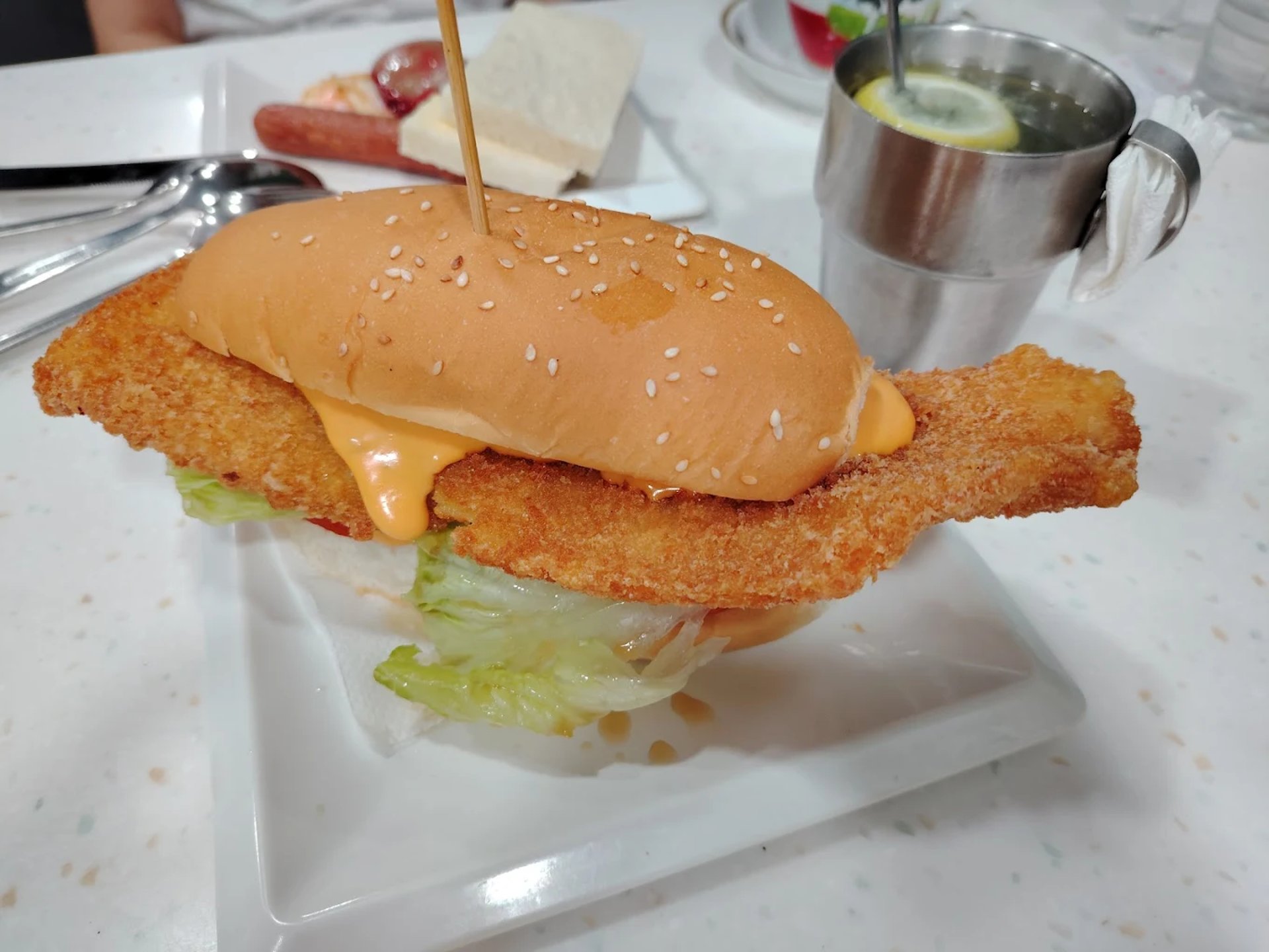 woman wearing yellow long-sleeved dress under white clouds and blue sky during daytime