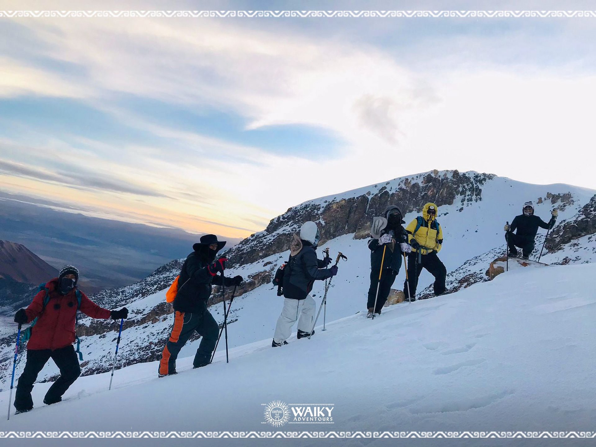 an abstract photo of a curved building with a blue sky in the background