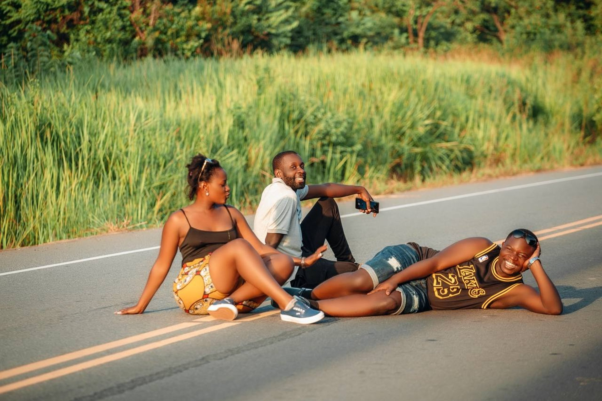 woman wearing yellow long-sleeved dress under white clouds and blue sky during daytime