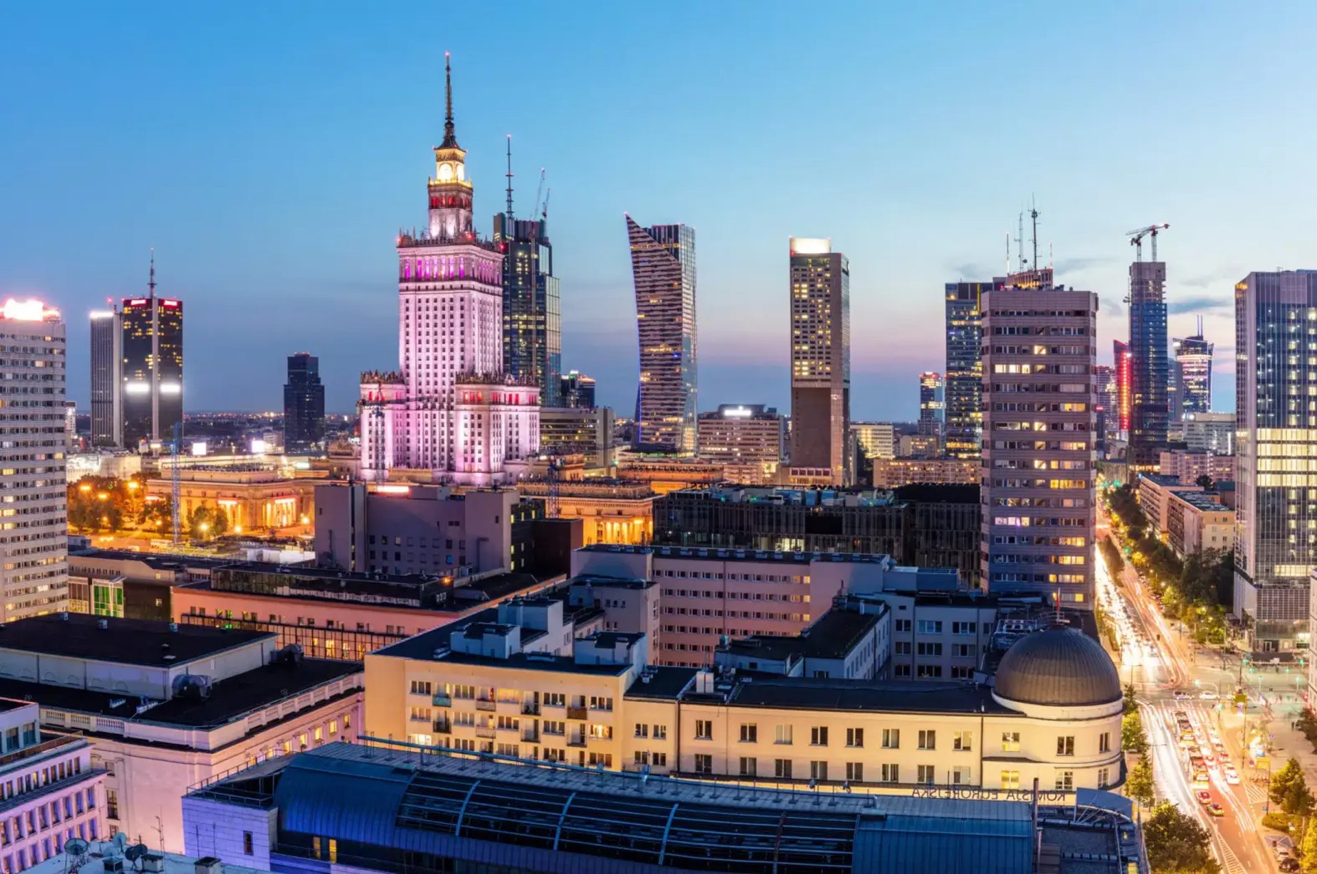 an abstract photo of a curved building with a blue sky in the background