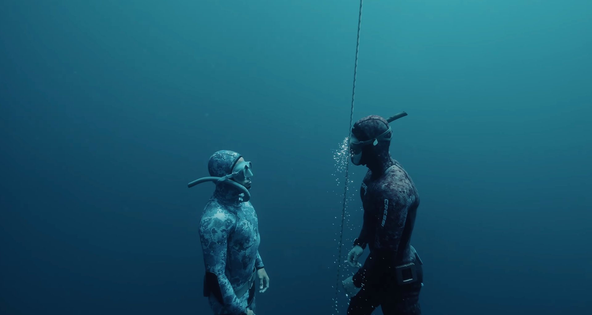 an abstract photo of a curved building with a blue sky in the background