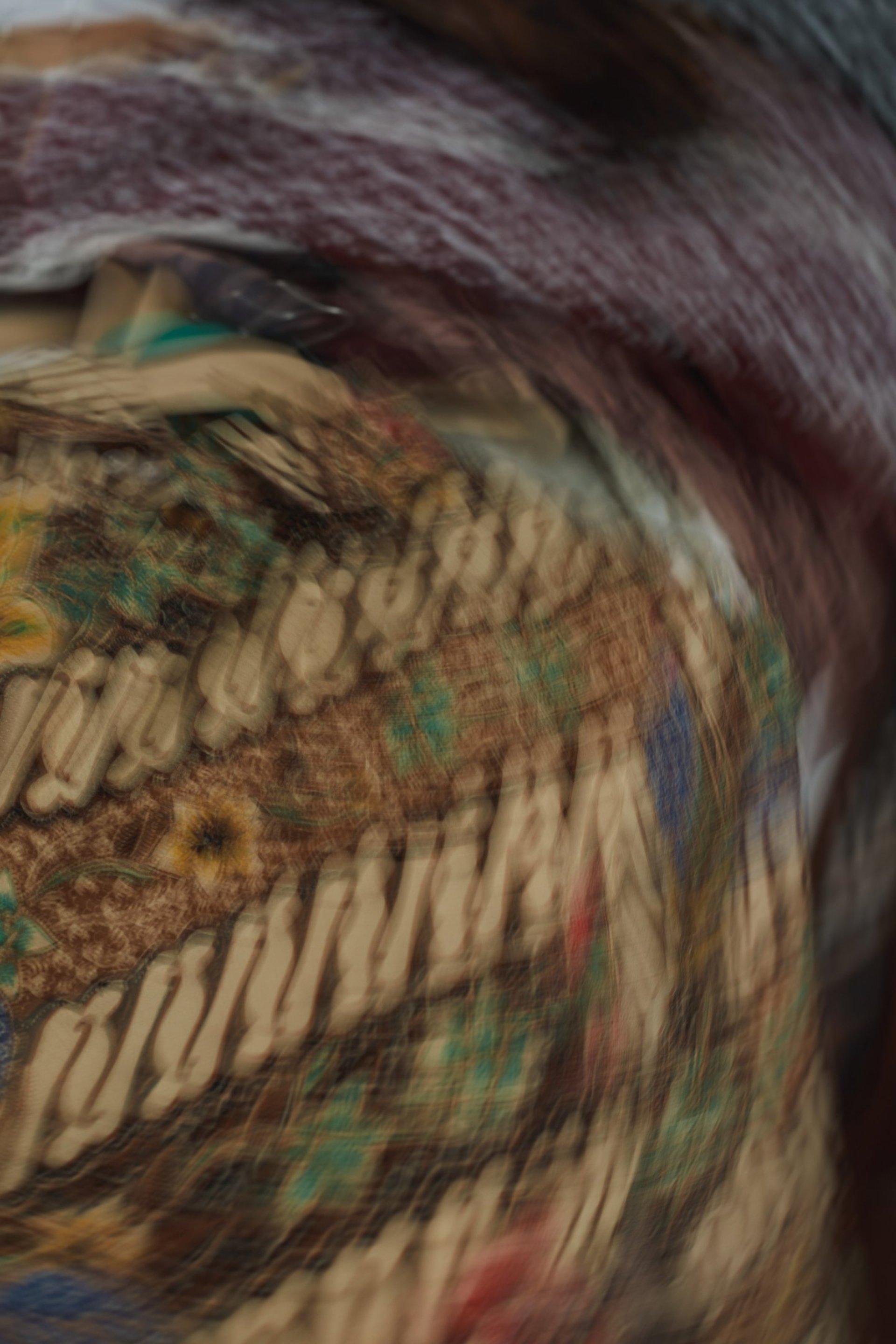 an abstract photo of a curved building with a blue sky in the background