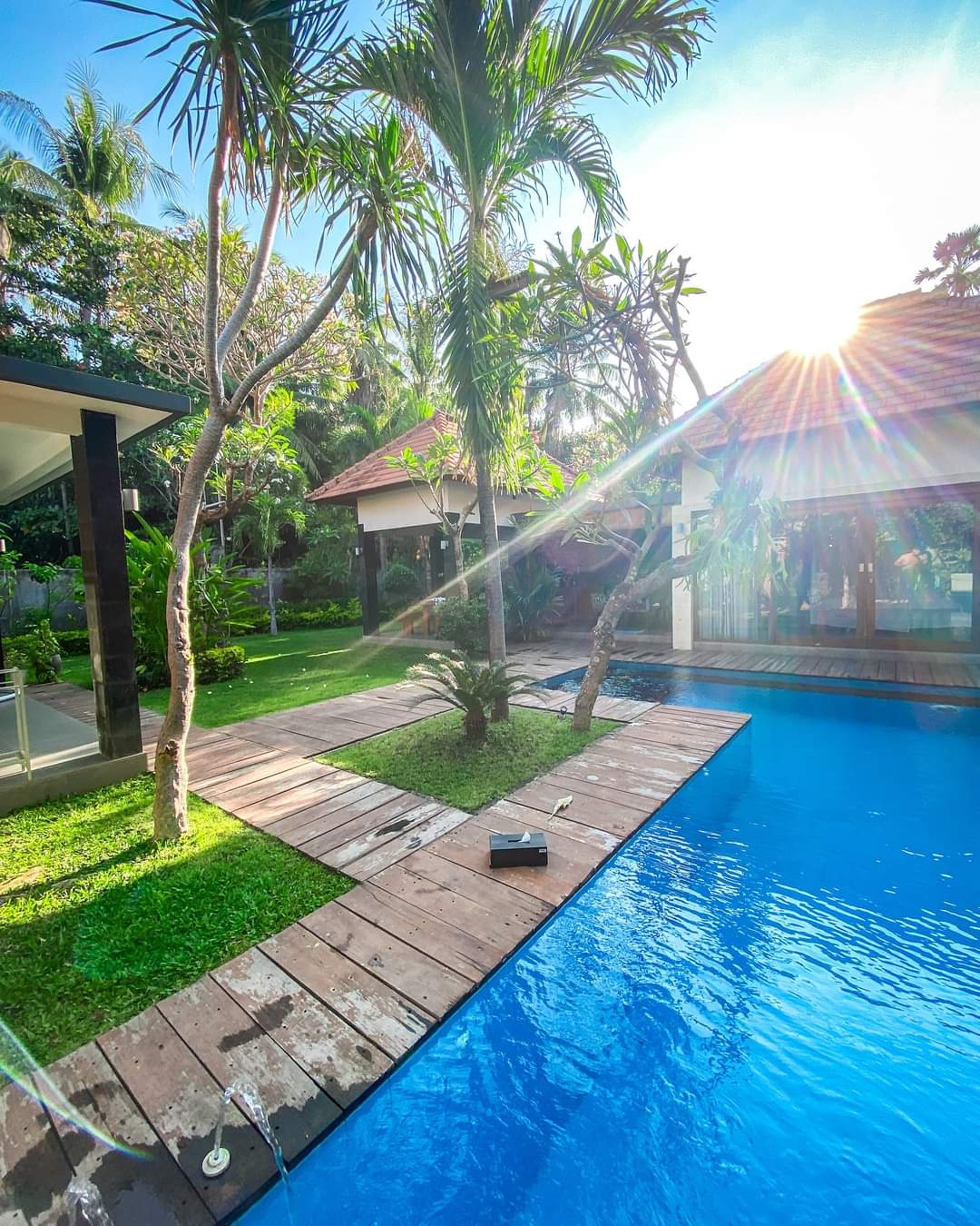 woman wearing yellow long-sleeved dress under white clouds and blue sky during daytime