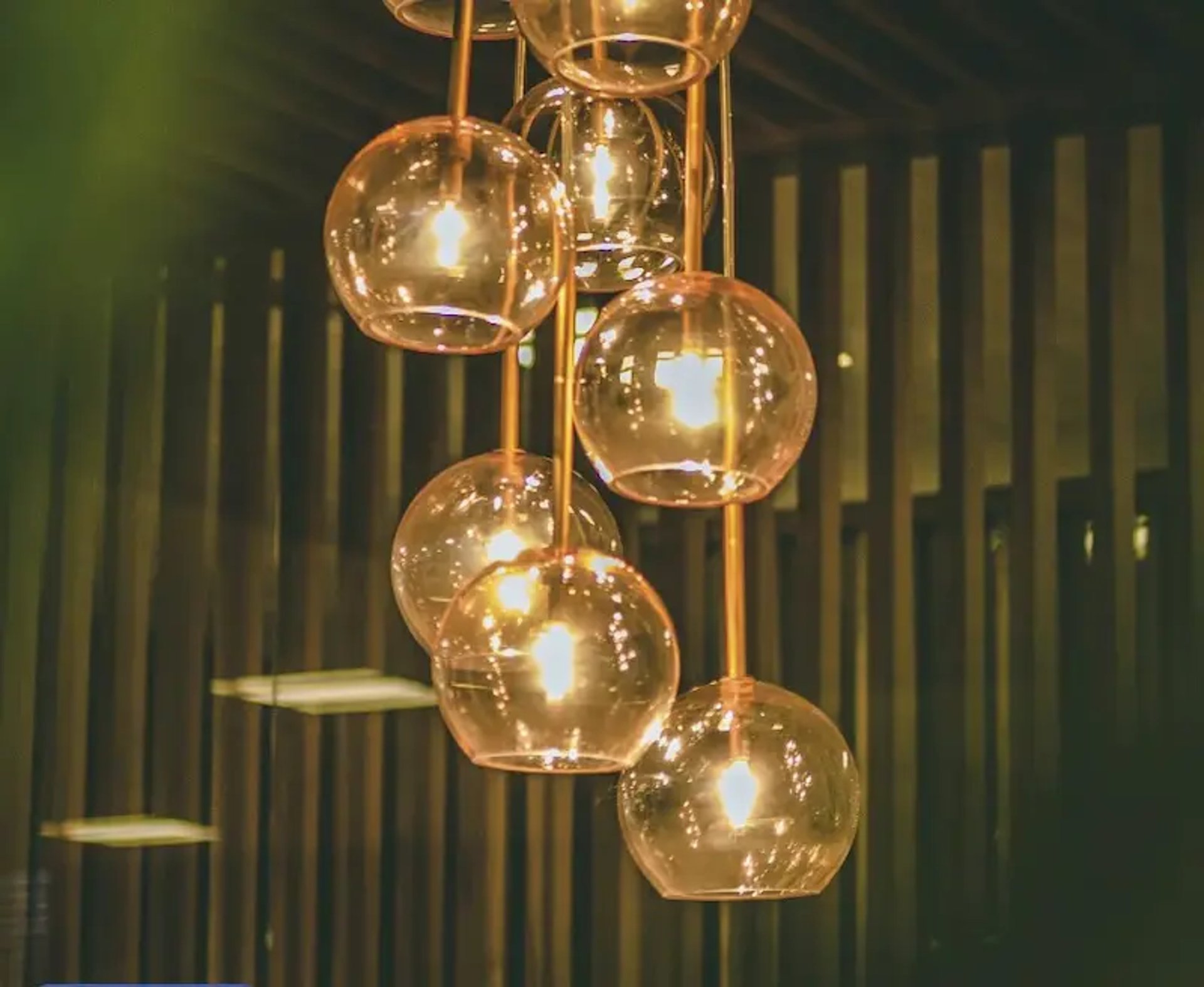 selective focus photography of lit pendant lights