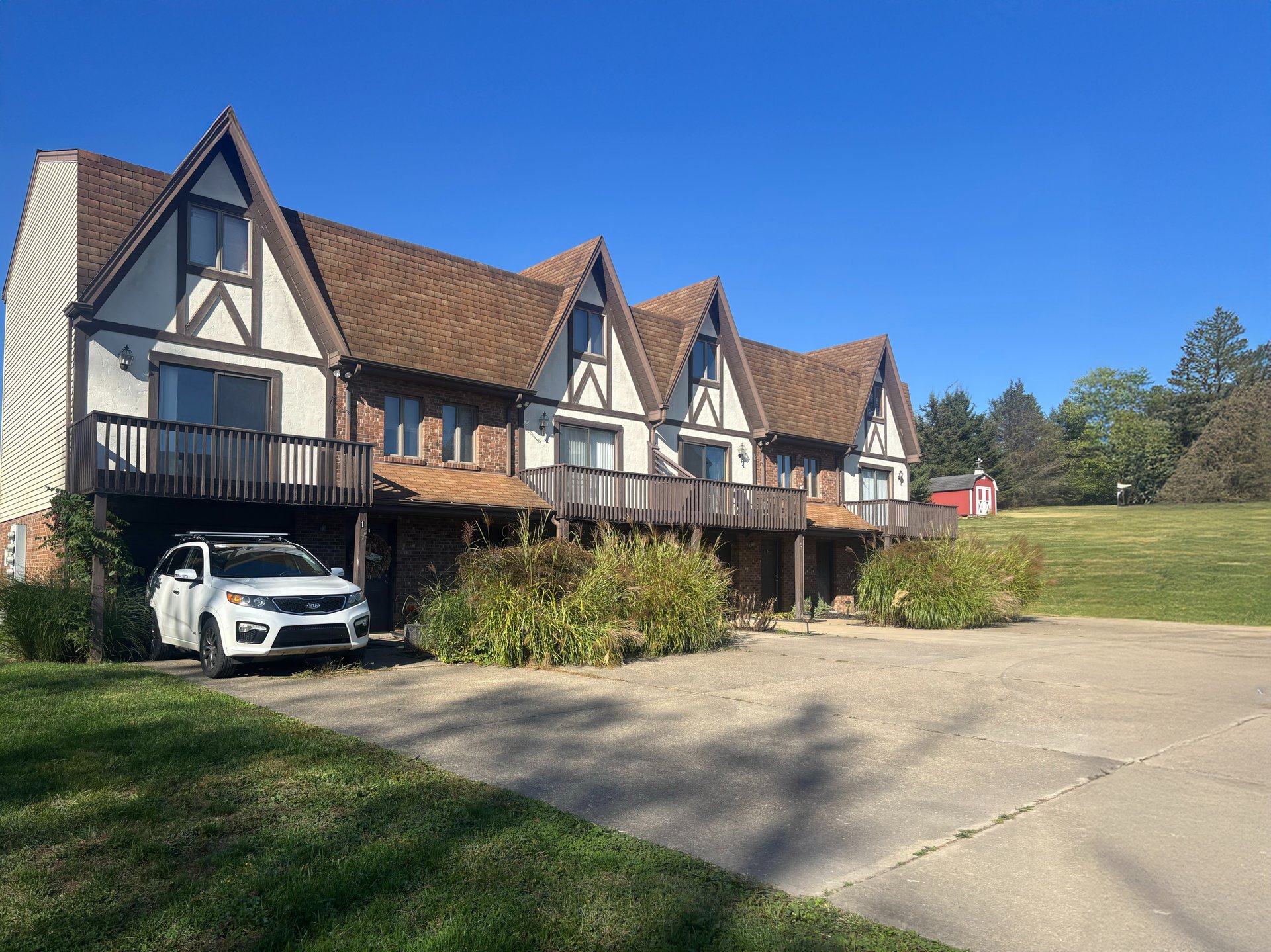 an abstract photo of a curved building with a blue sky in the background