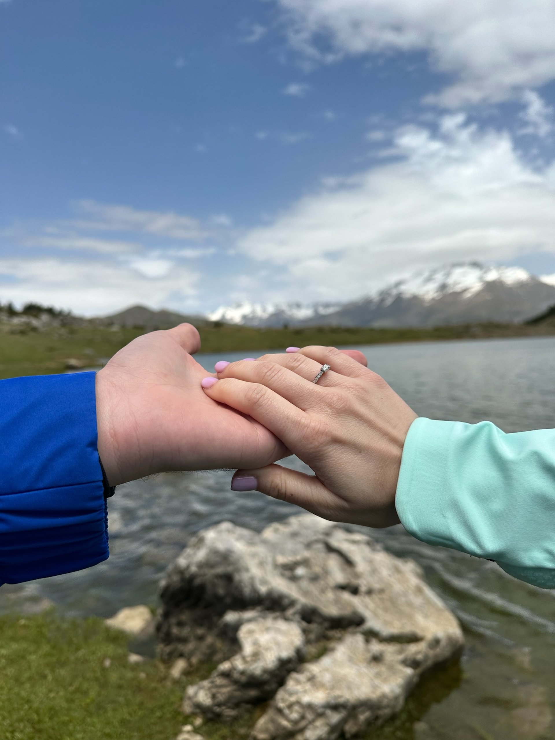 couple wearing silver-colored rings