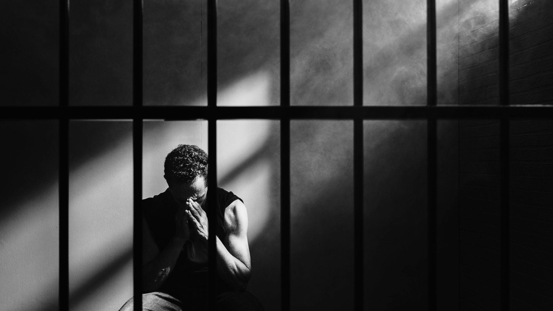 an abstract photo of a curved building with a blue sky in the background