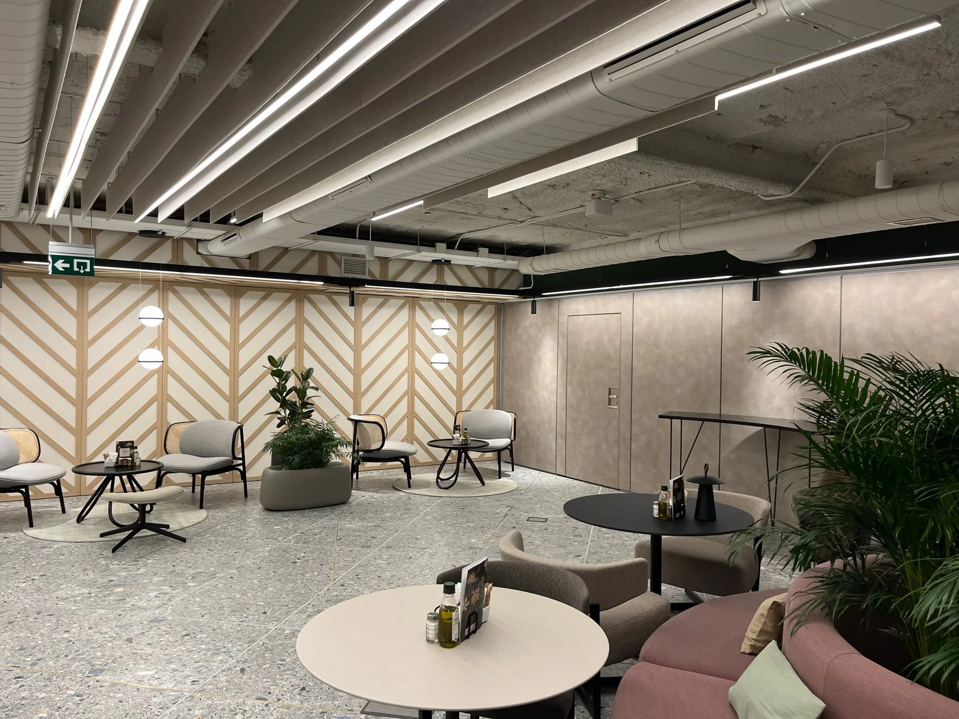 an abstract photo of a curved building with a blue sky in the background