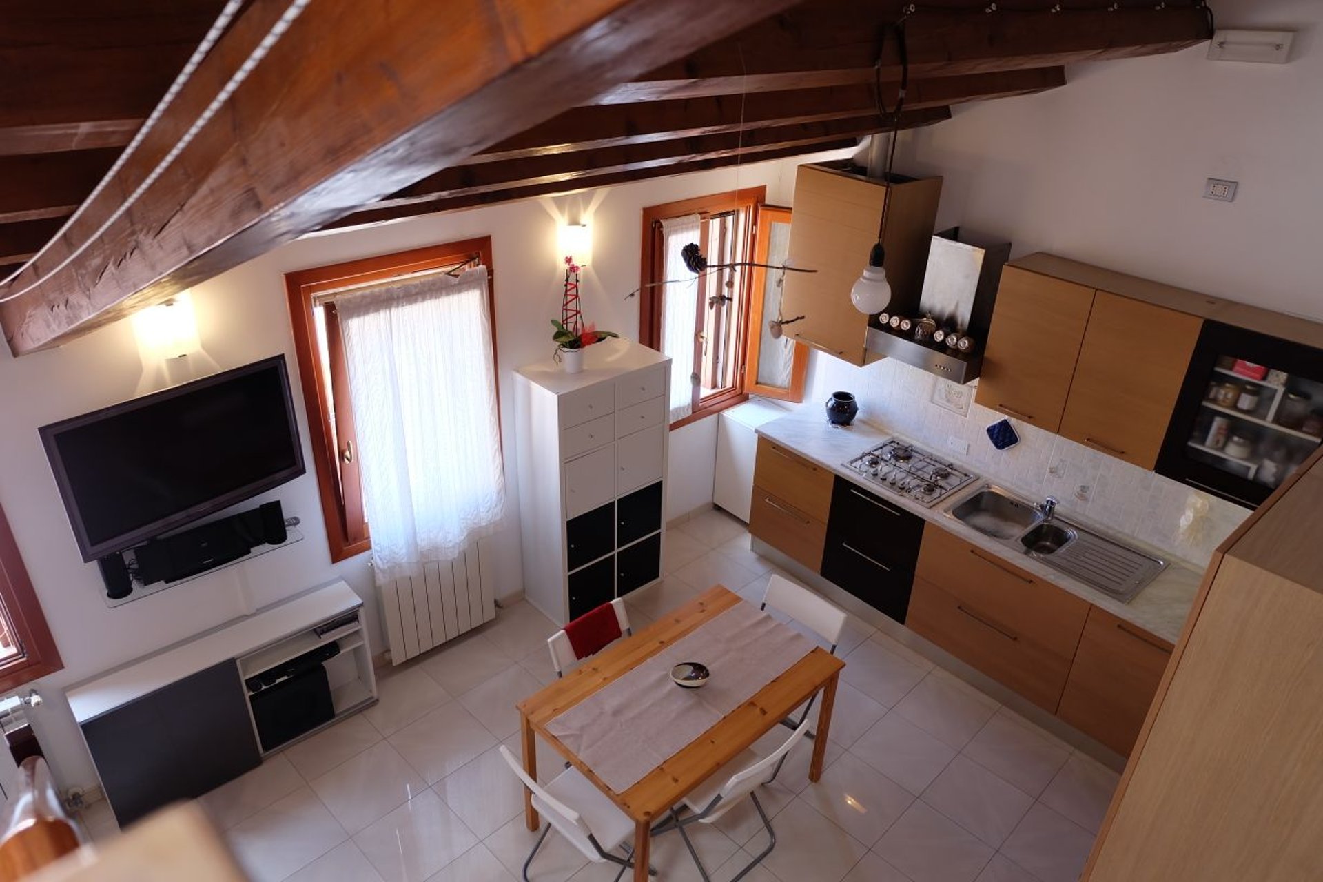 woman wearing yellow long-sleeved dress under white clouds and blue sky during daytime