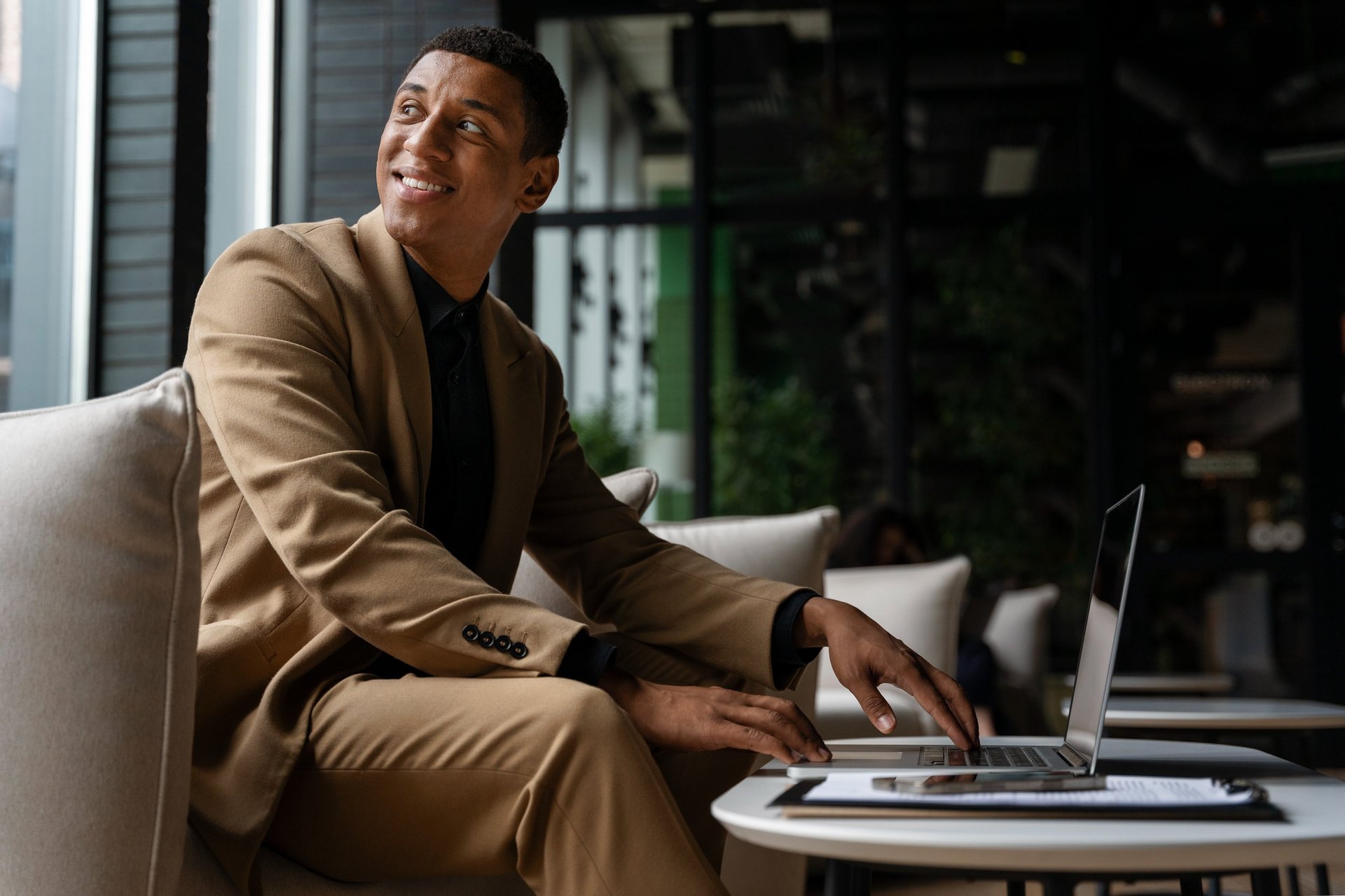 an abstract photo of a curved building with a blue sky in the background