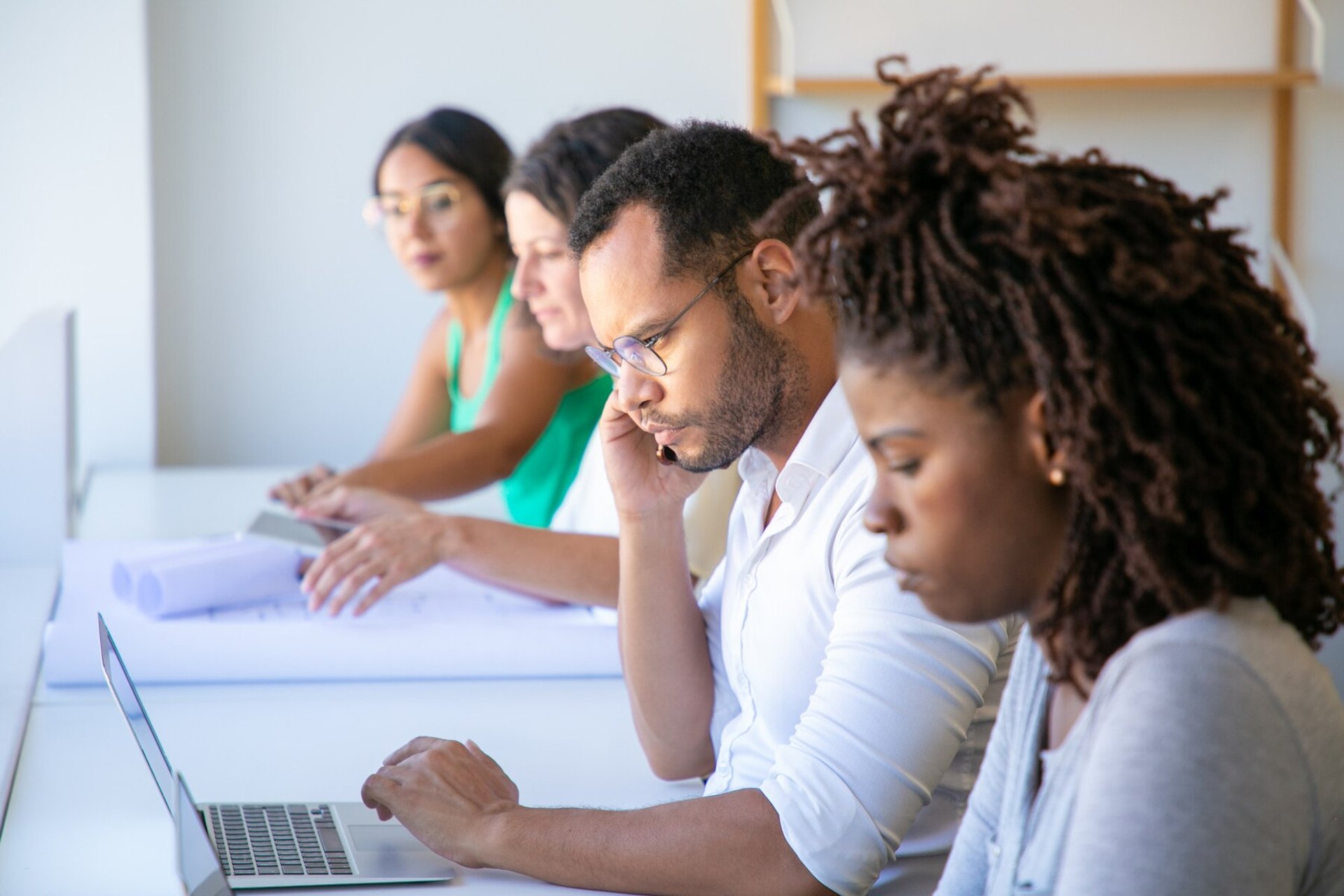 an abstract photo of a curved building with a blue sky in the background