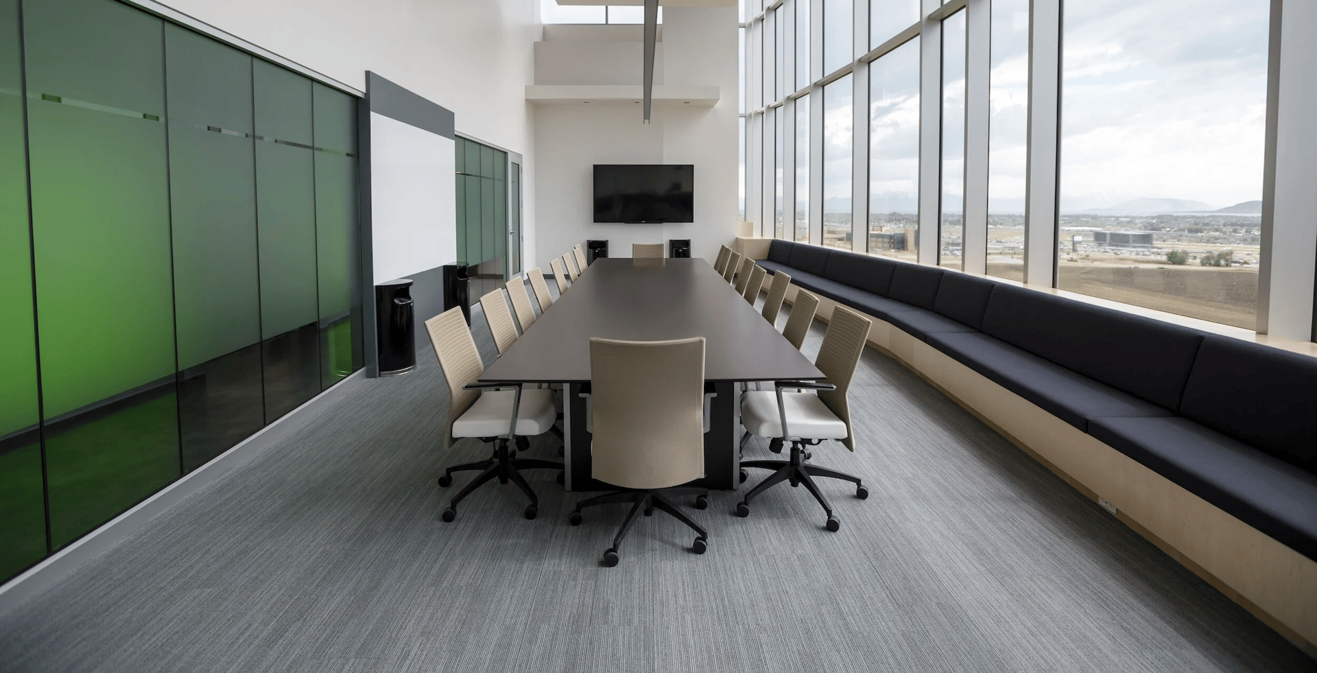 brown concrete Ganesha statue standing behind the plants