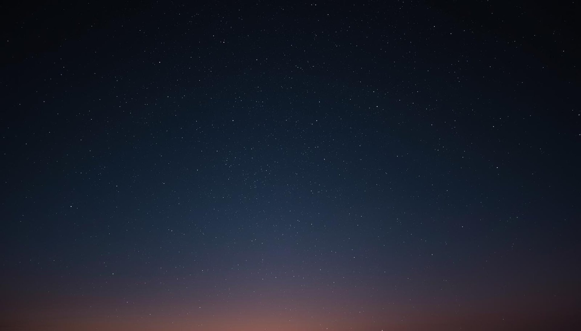 silhouette of mountain during night time