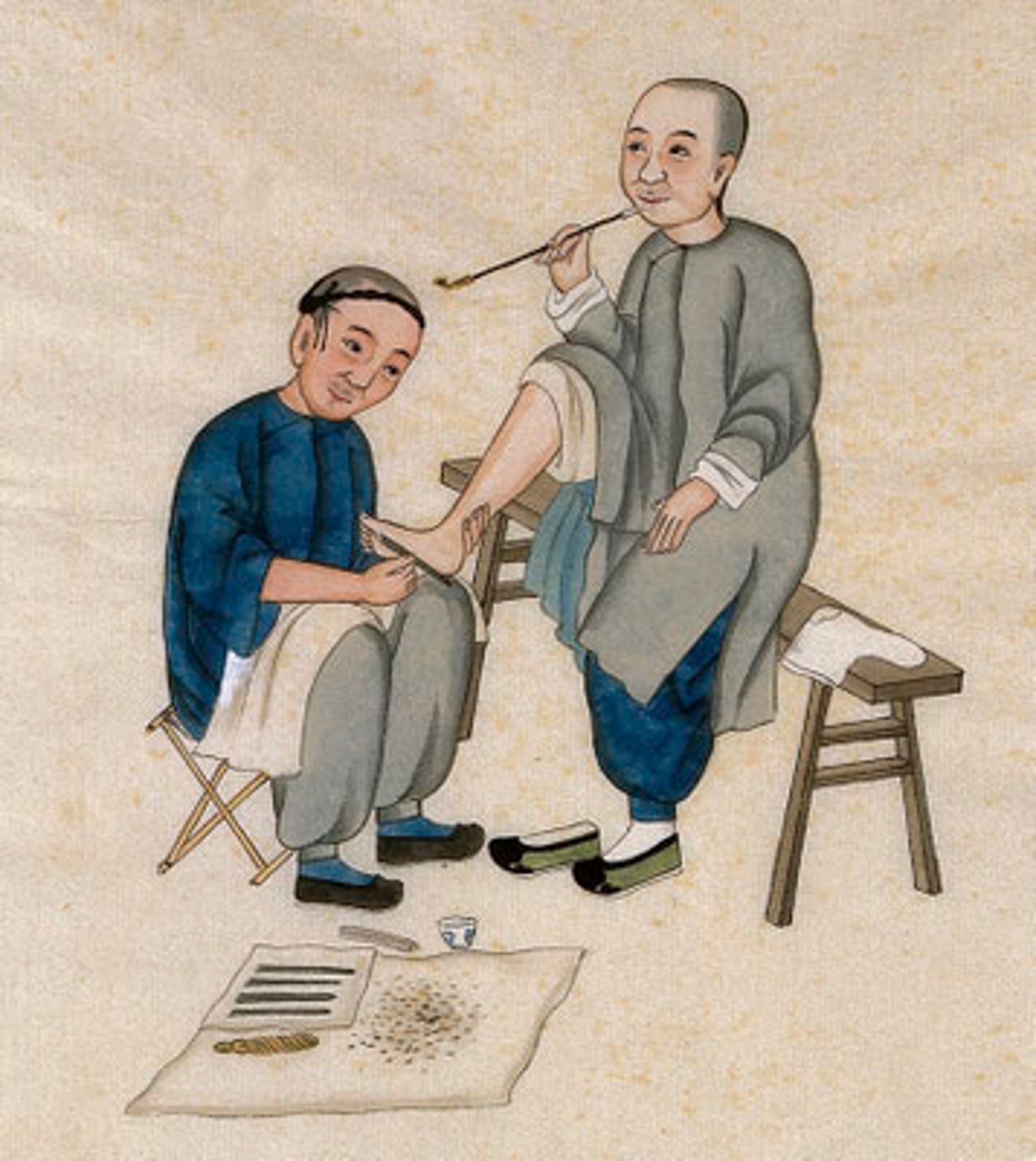 a pair of footprints in the sand of a beach