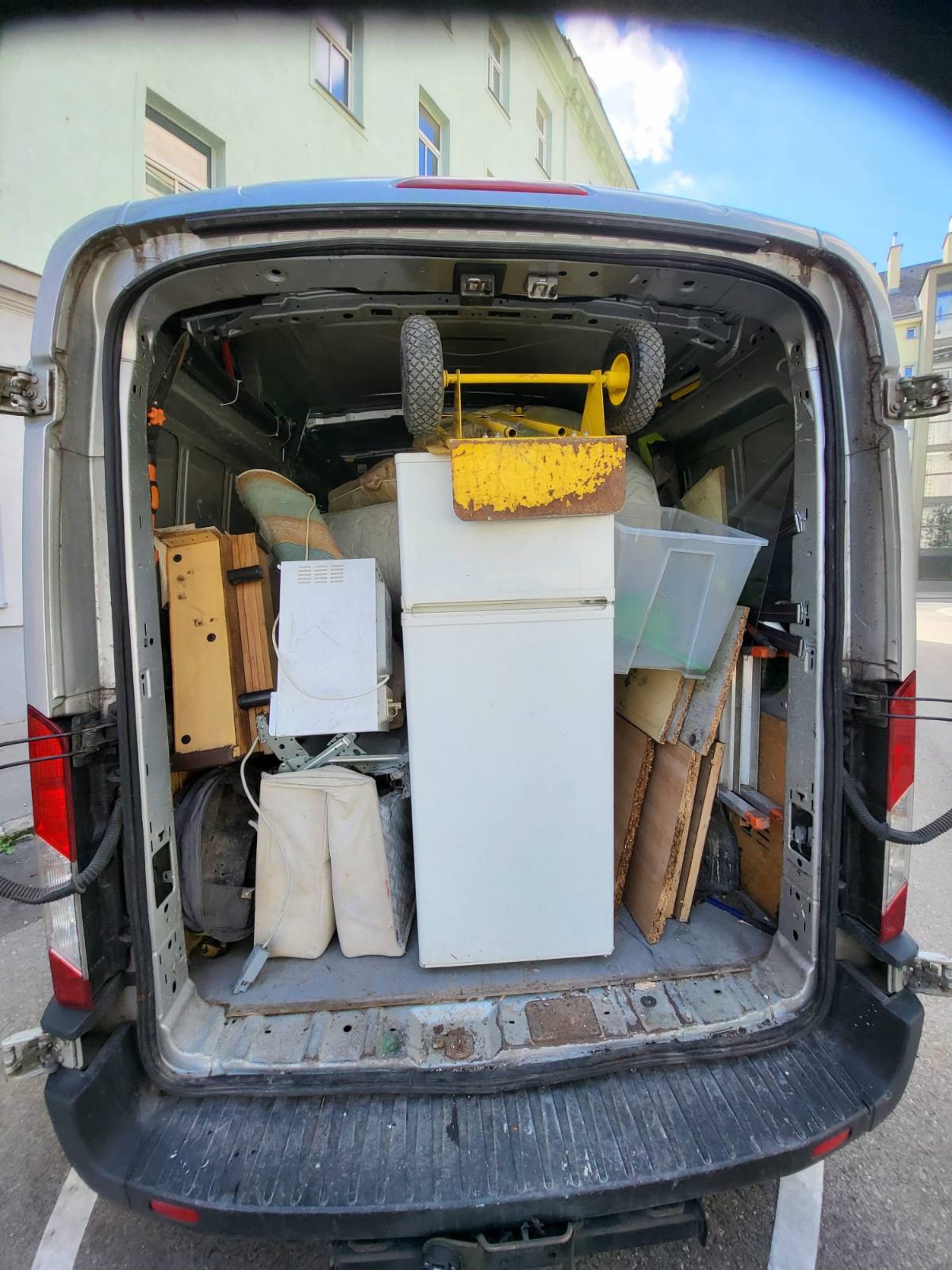 an abstract photo of a curved building with a blue sky in the background