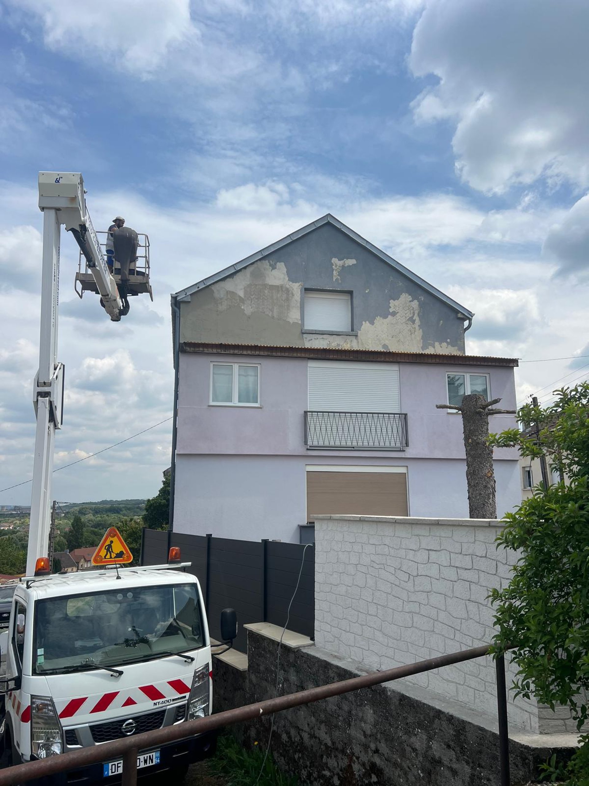 a man on a roof working with a rope