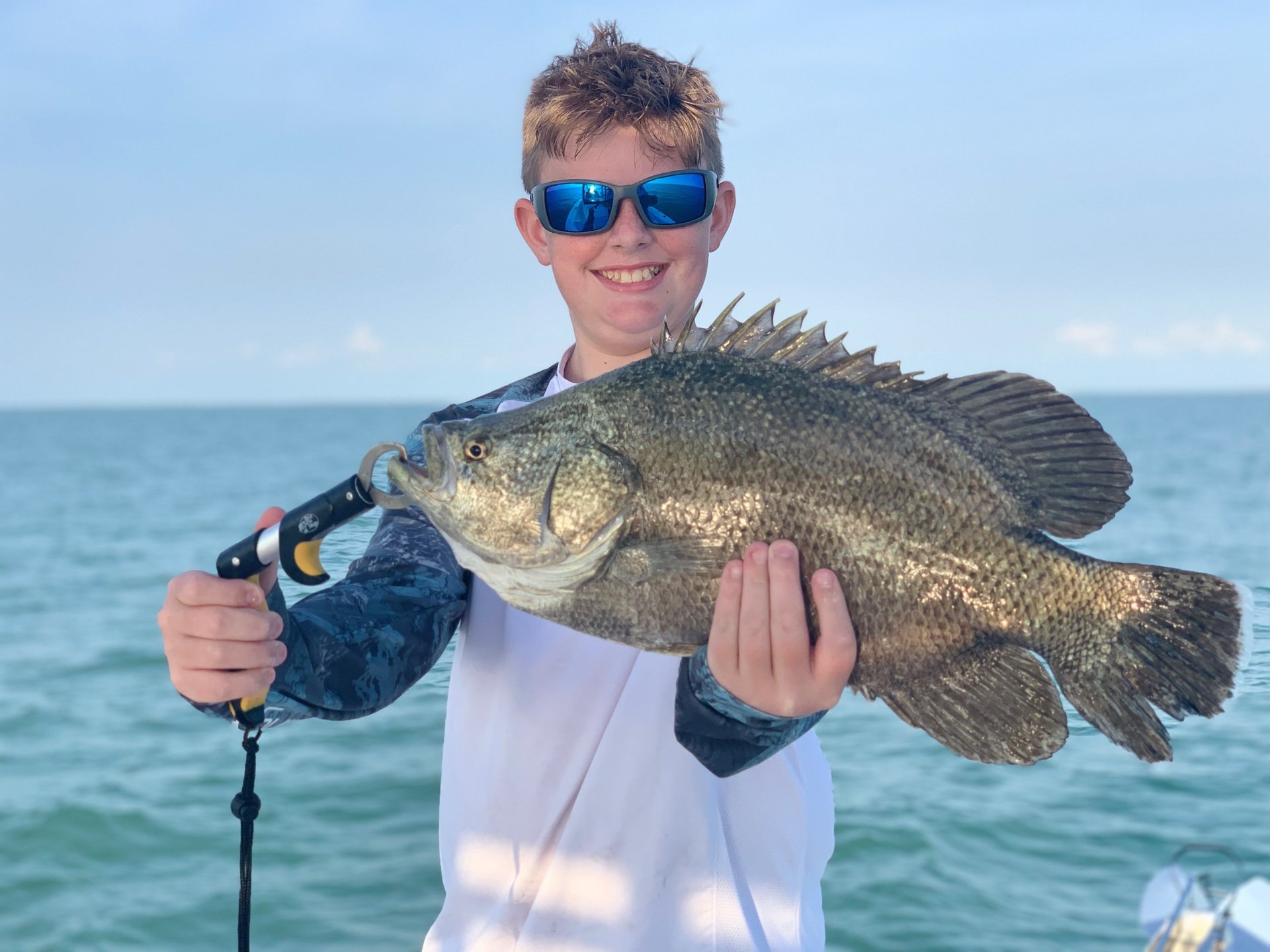 four black fishing rods