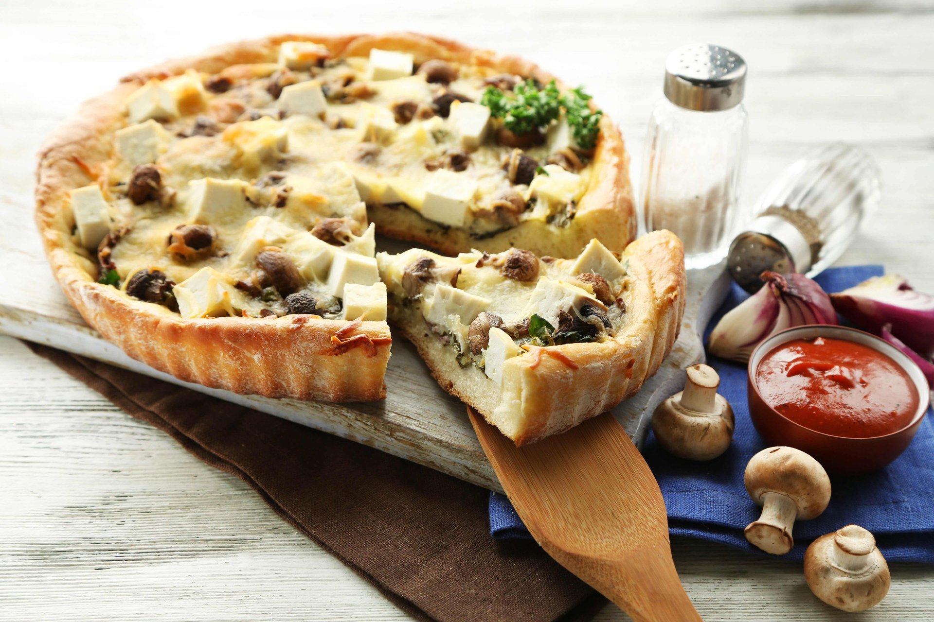 an abstract photo of a curved building with a blue sky in the background