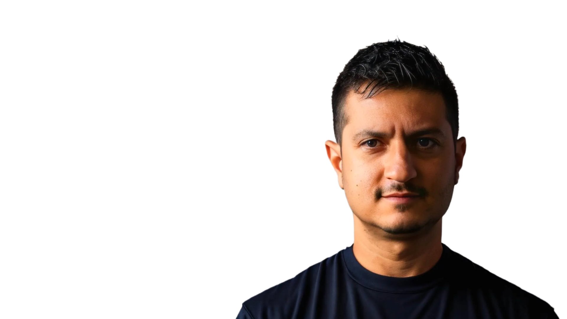 woman in black long sleeve shirt and blue denim jeans sitting on white concrete wall