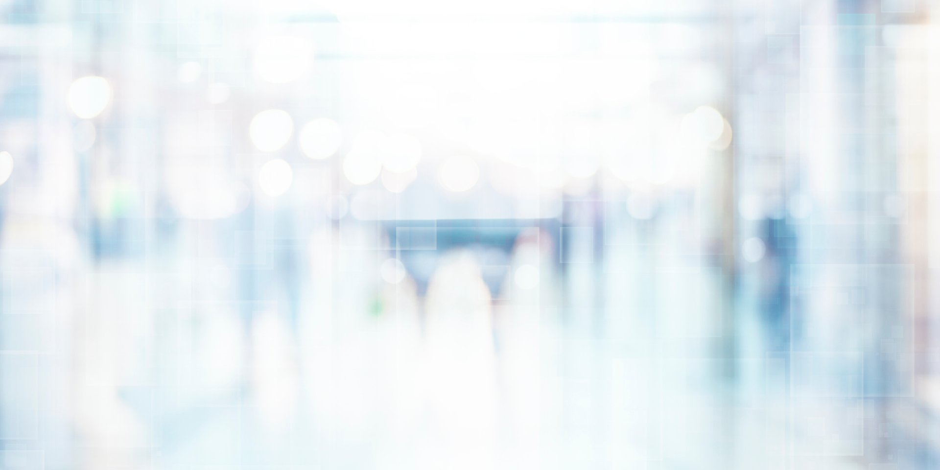 gray wooden table beside wing chair