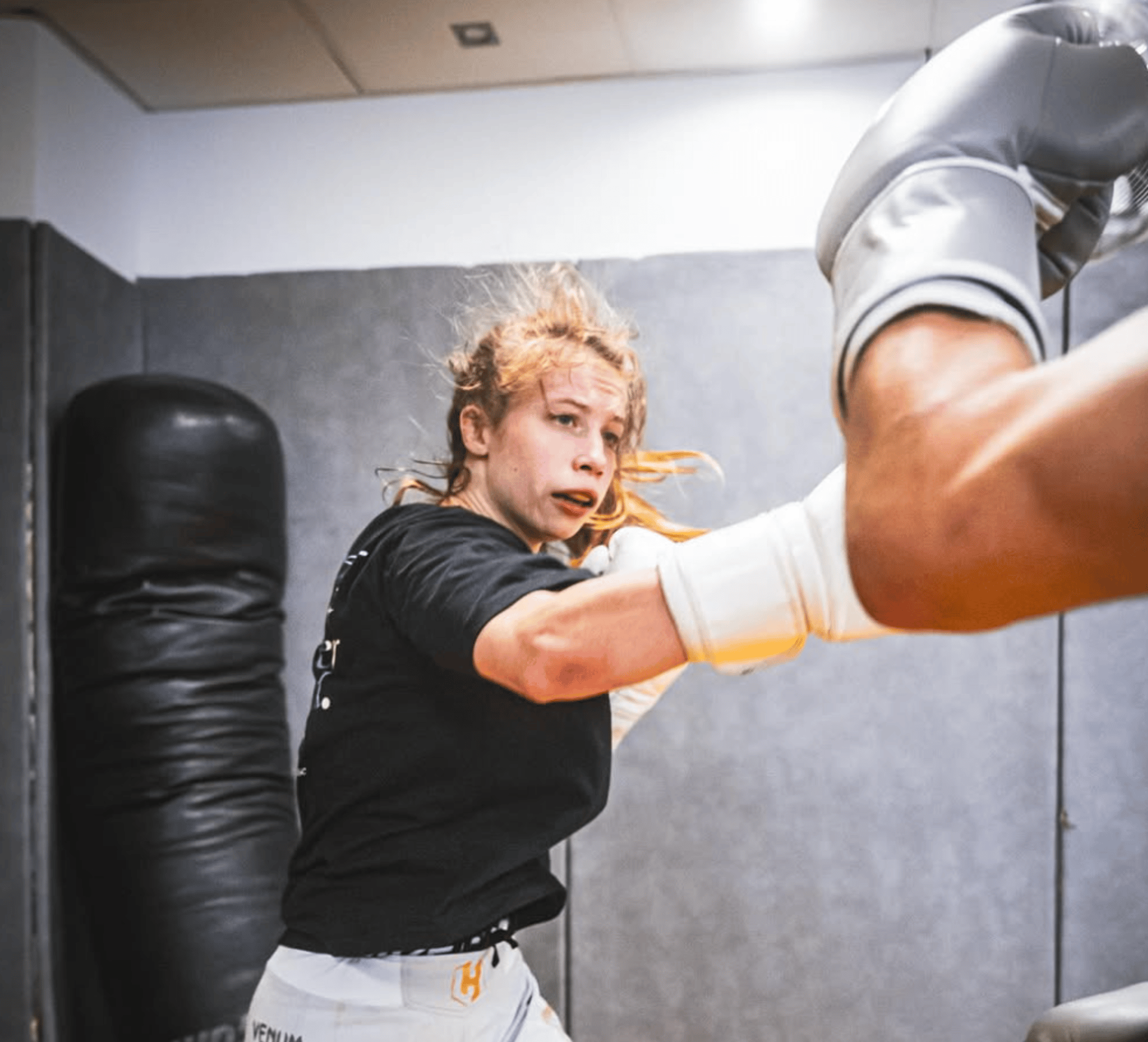 an abstract photo of a curved building with a blue sky in the background