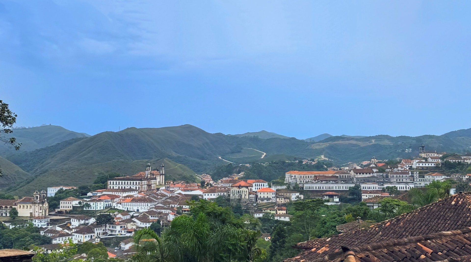 an abstract photo of a curved building with a blue sky in the background