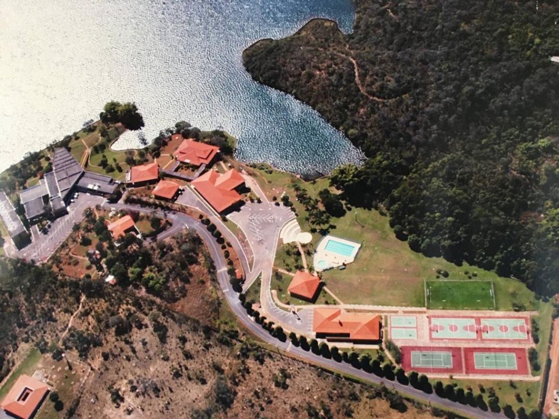 an abstract photo of a curved building with a blue sky in the background
