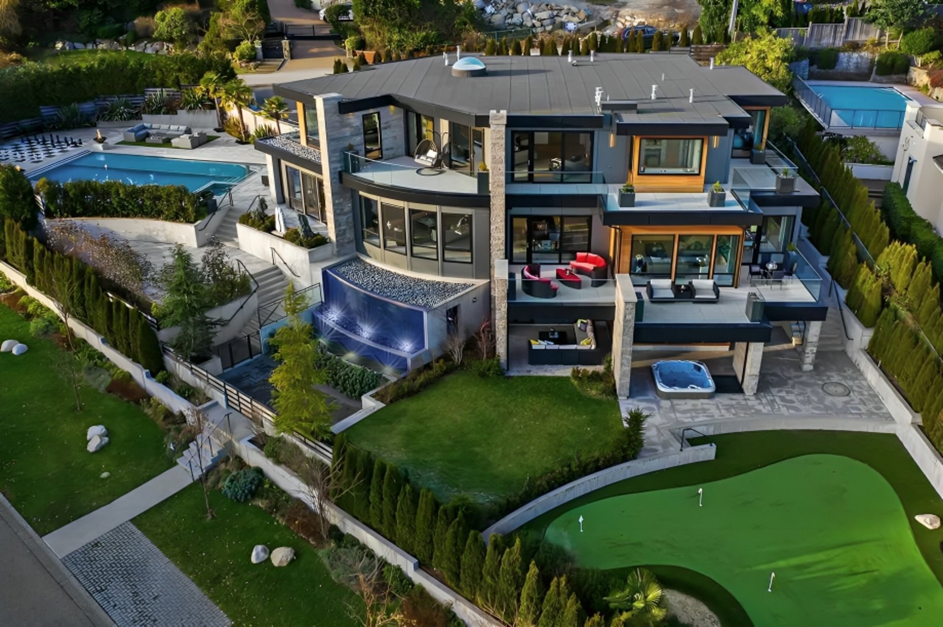 a person walking in a flower garden in front of a building