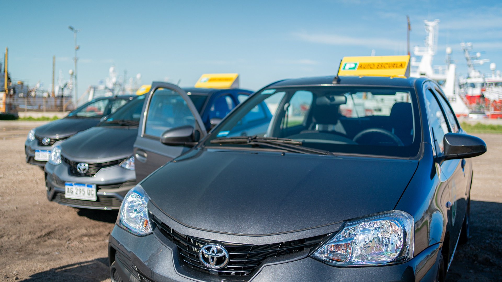 an abstract photo of a curved building with a blue sky in the background
