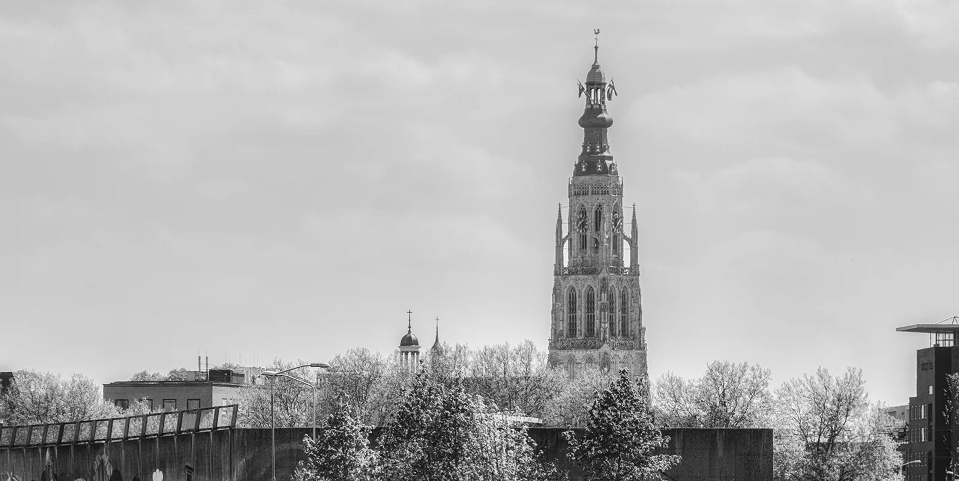 an abstract photo of a curved building with a blue sky in the background