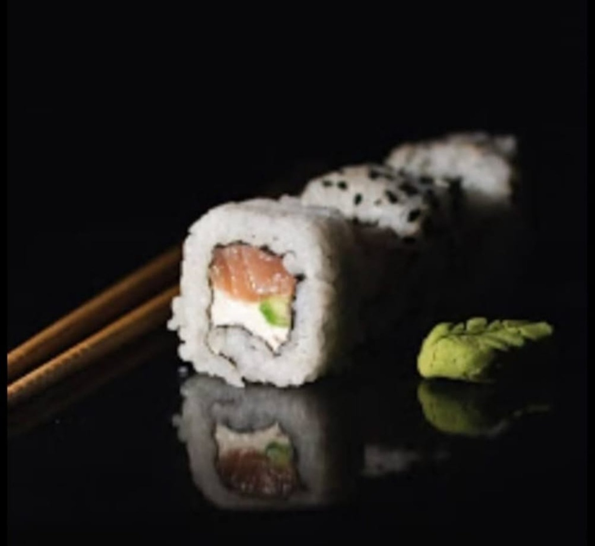 an abstract photo of a curved building with a blue sky in the background